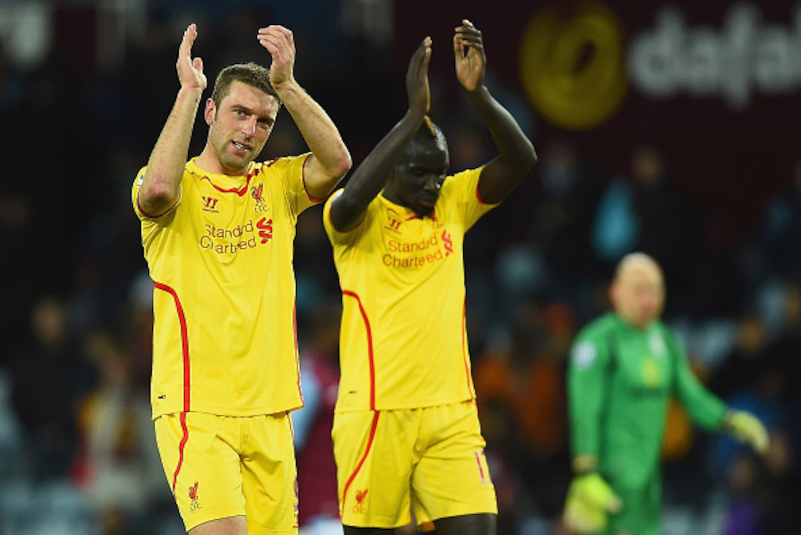 BIRMINGHAM, ENGLAND - JANUARY 17:  Rickie Lambert and Mamadou Sakho of Liverpool applaud the fans after the Barclays Premier League match between Aston Villa and Liverpool at Villa Park on January 17, 2015 in Birmingham, England.  (Photo by Laurence Griff