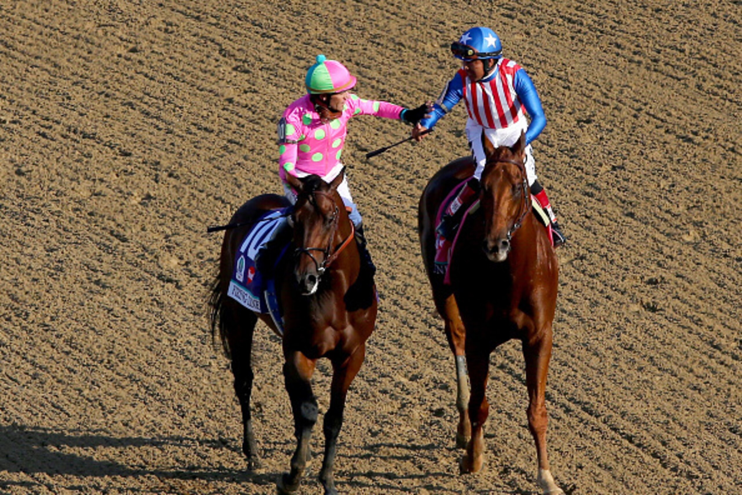 LOUISVILLE, KY - MAY 02: Jockey Gary Stevens, atop Firing Line #10, celebrates placing with Martin Garcia, atop Dortmund #8, during the 141st running of the Kentucky Derby at Churchill Downs on May 2, 2015 in Louisville, Kentucky. (Photo by Elsa/Getty I LOUISVILLE, KY - MAY 02: Jockey Gary Stevens, atop Firing Line #10, celebrates placing with Martin Garcia, atop Dortmund #8, during the 141st running of the Kentucky Derby at Churchill Downs on May 2, 2015 in Louisville, Kentucky. (Photo by Elsa/Getty I