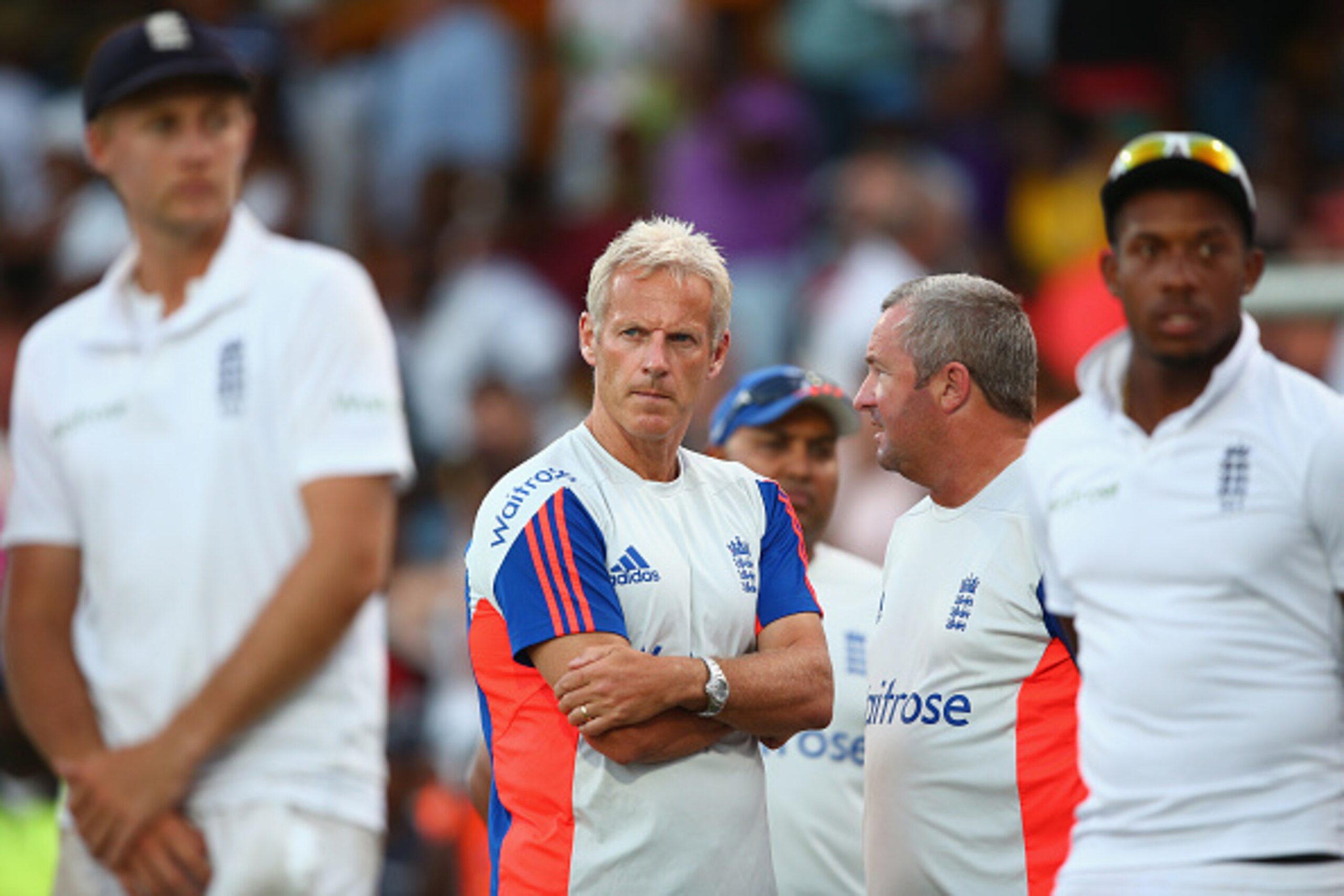 BRIDGETOWN, BARBADOS - MAY 03:  Peter Moores (2L) the Head Coach of England  looks on alongside assistant coach Paul Farbrace (2) at the after match presentations as the series was squared 1-1 after West Indies won the match by five wickets during day thr