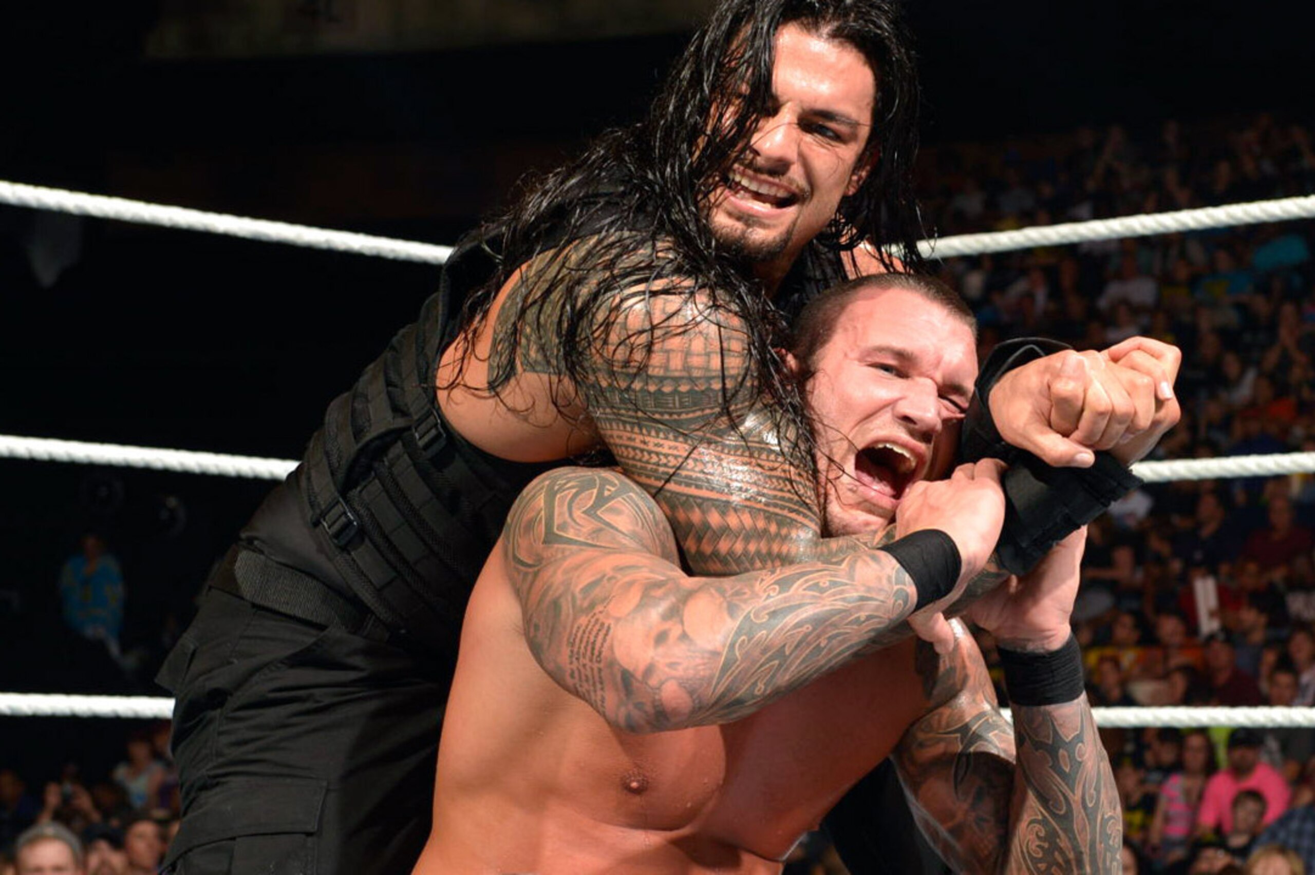 Roman Reigns in control of Randy Orton.