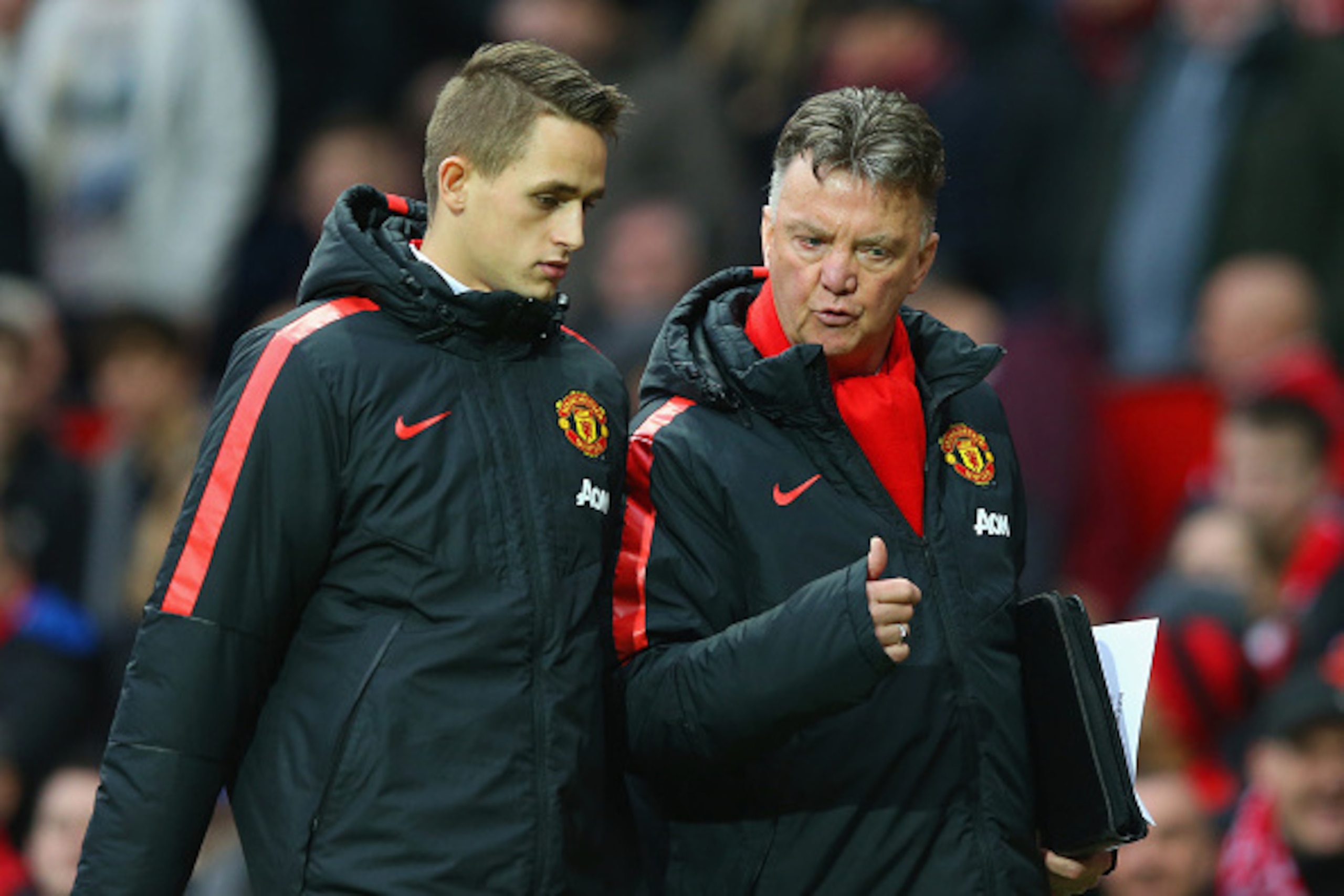 MANCHESTER, ENGLAND - FEBRUARY 28:  Manager Louis van Gaal of Manchester United speaks to Adnan Januzaj of Manchester United atr half time during the Barclays Premier League match between Manchester United and Sunderland at Old Trafford on February 28, 20