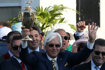 LOUISVILLE, KY - MAY 02:  Trainer Bob Baffert of American Pharoah #18 celebrates with the trophy in winners circle after winning the 141st running of the Kentucky Derby at Churchill Downs on May 2, 2015 in Louisville, Kentucky.  (Photo by Andy Lyons/Getty