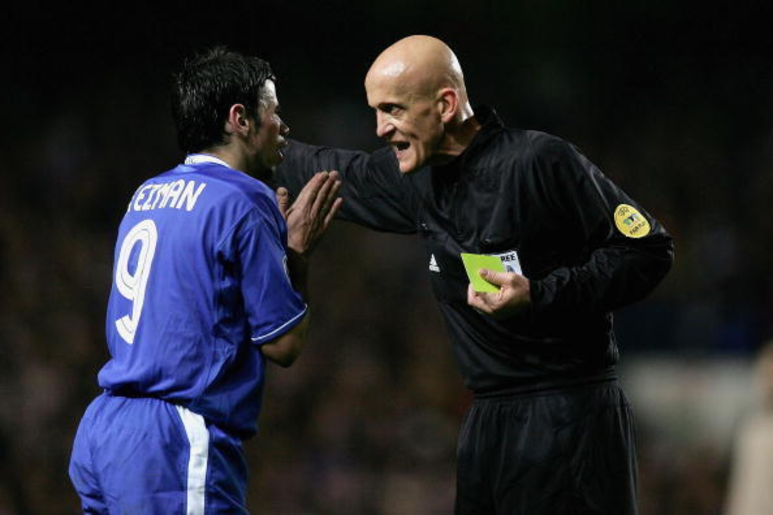 LONDON - MARCH 8:  Mateja Kezman of Chelsea is booked (misses the next match) by Pierluigi Collina, the referee, during the UEFA Champions League, First Knockout Round, Second Leg match between Chelsea and Barcelona at Stamford Bridge on March 8, 2005 in 