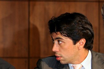 The relationship between Tevez and agent Kia Joorabchian (right) has heavily shaped the Argentina striker's public image.