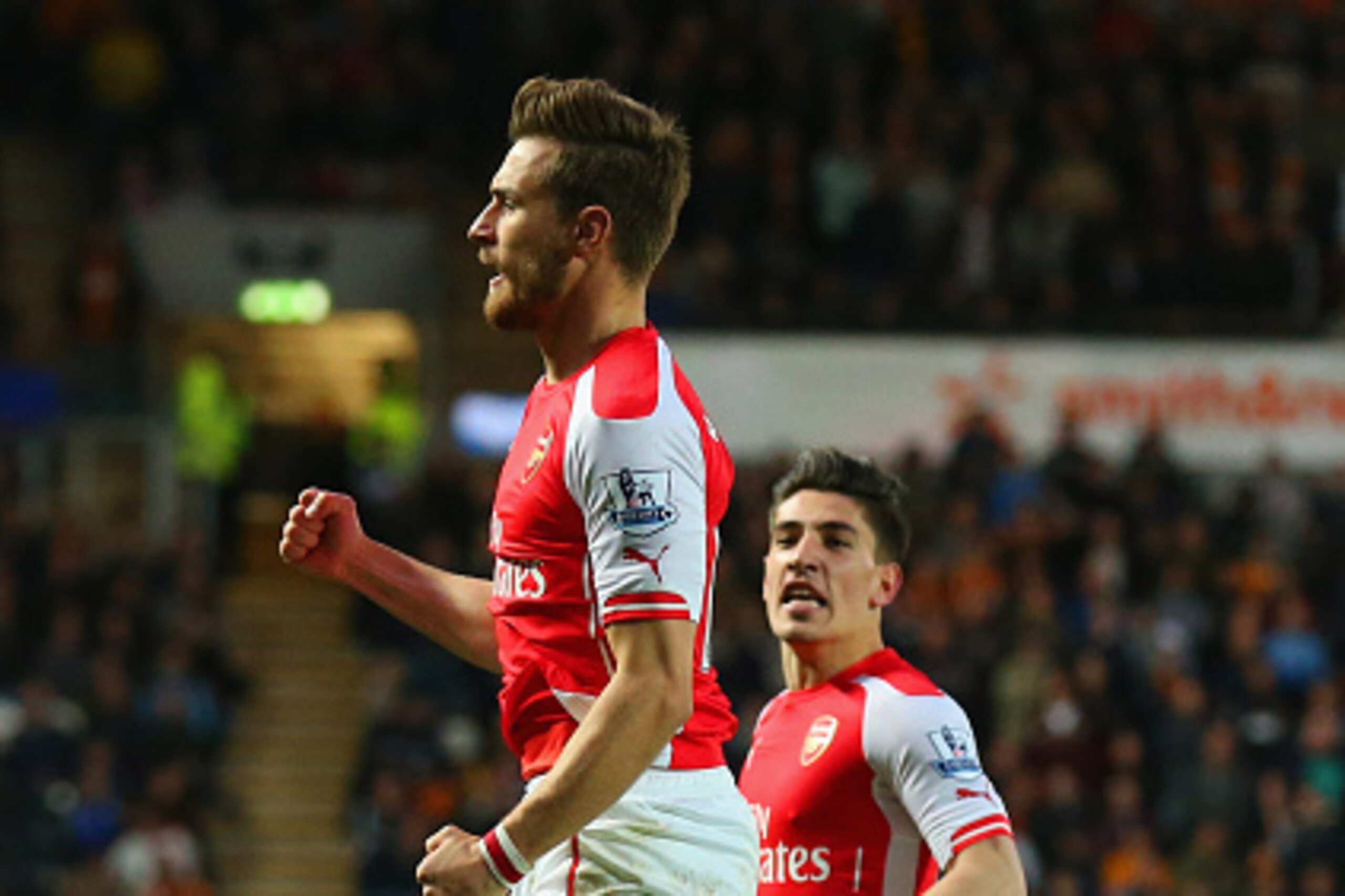 HULL, ENGLAND - MAY 04:  Aaron Ramsey of Arsenal (L) celebrates with Hector Bellerin as he scores their second goal during the Barclays Premier League match between Hull City and Arsenal at KC Stadium on May 4, 2015 in Hull, England.  (Photo by Alex Lives