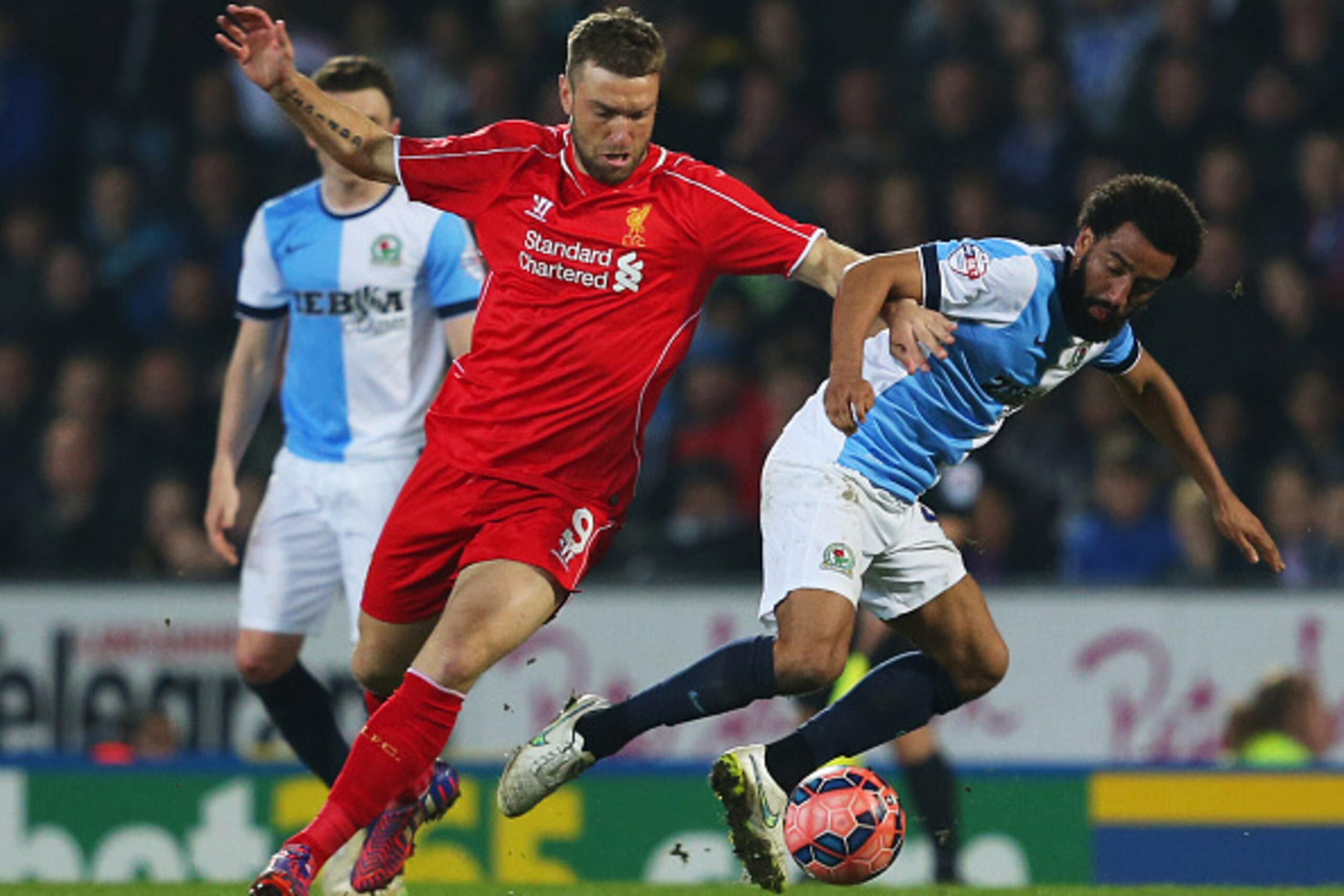 BLACKBURN, ENGLAND - APRIL 08:  Lee Williamson of Blackburn Rovers battles with Rickie Lambert of Liverpool during the FA Cup Quarter Final Replay match between Blackburn Rovers and Liverpool at Ewood Park on April 8, 2015 in Blackburn, England.  (Photo b