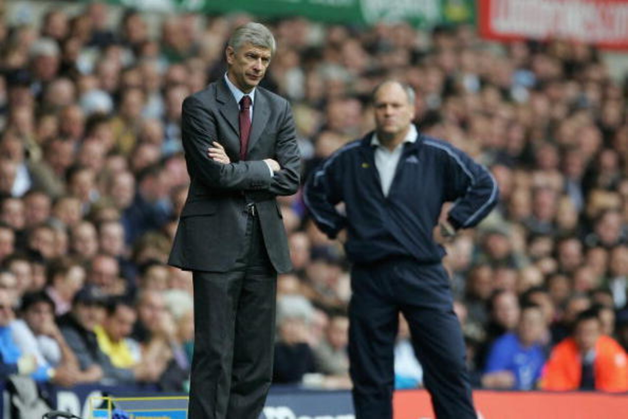 LONDON - OCTOBER 29: Arsenal manager Arsene Wenger looks on shadowed by Tottenham manager Martin Jol the during the Barclays Premiership match between Tottenham Hotspur and Arsenal at White Hart Lane on October 29, 2005 in London, England.  (Photo by Rich