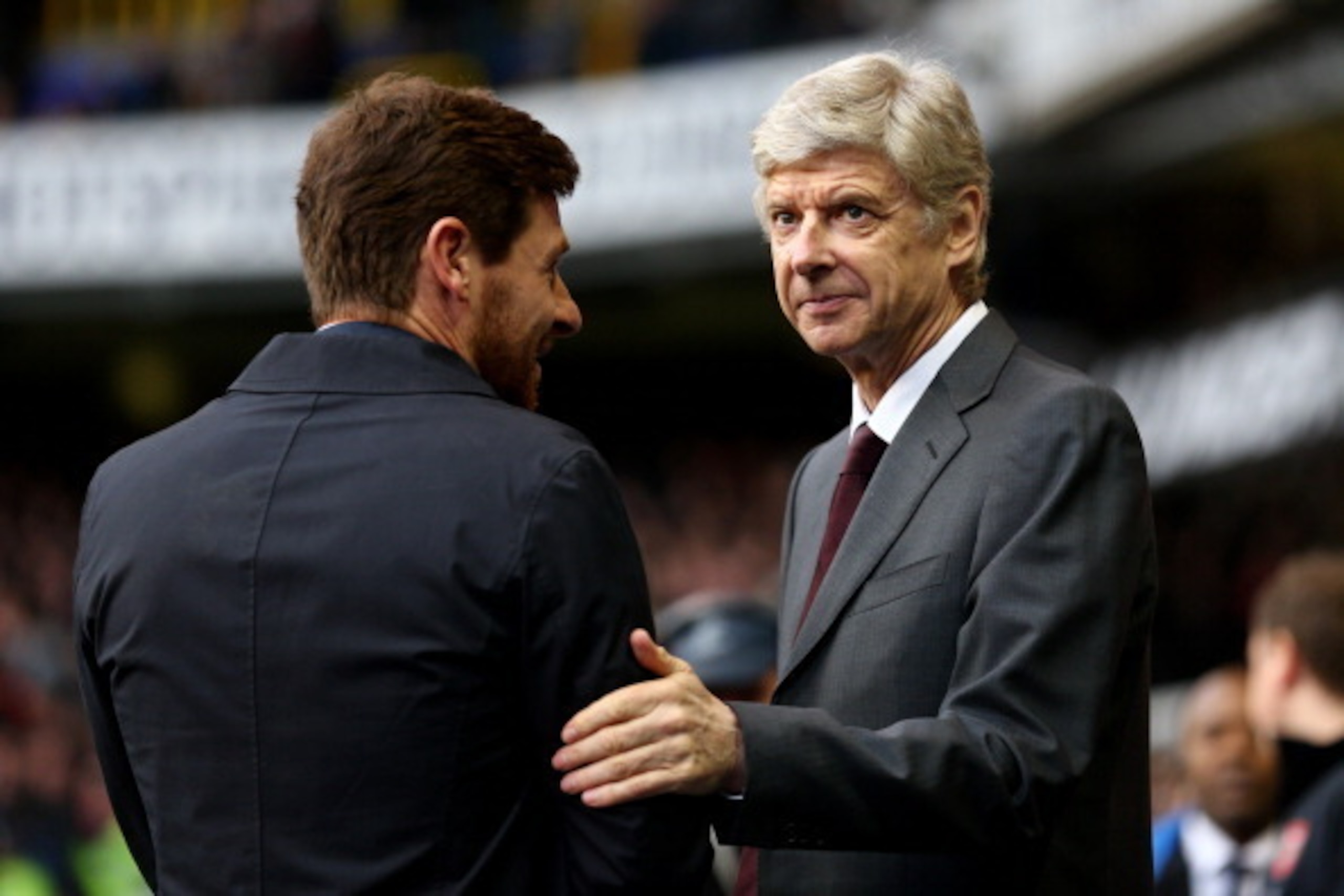 LONDON, ENGLAND - MARCH 03:  (L-R) Andre Villas-Boas the Spurs manager and Arsene Wenger the Arsenal manager speak prior to kickoff during the Barclays Premier League match between Tottenham Hotspur and Arsenal FC at White Hart Lane on March 3, 2013 in Lo