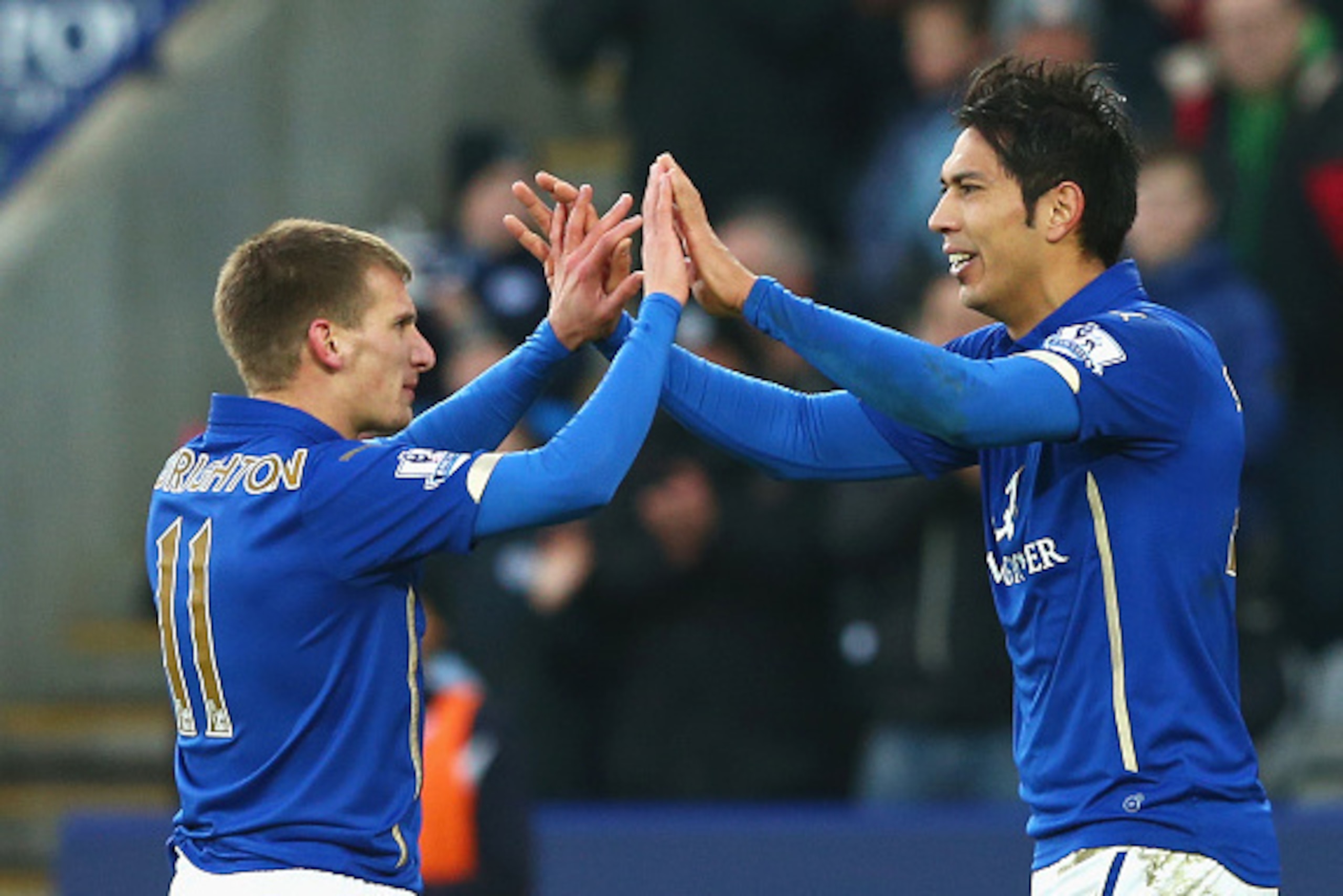 LEICESTER, ENGLAND - JANUARY 03:  Leonardo Ulloa (R) of Leicester City celebrates scoring the opening goal with Marc Albrighton of Leicester City during the FA Cup Third Round match between Leicester City and Newcastle United at The King Power Stadium on 