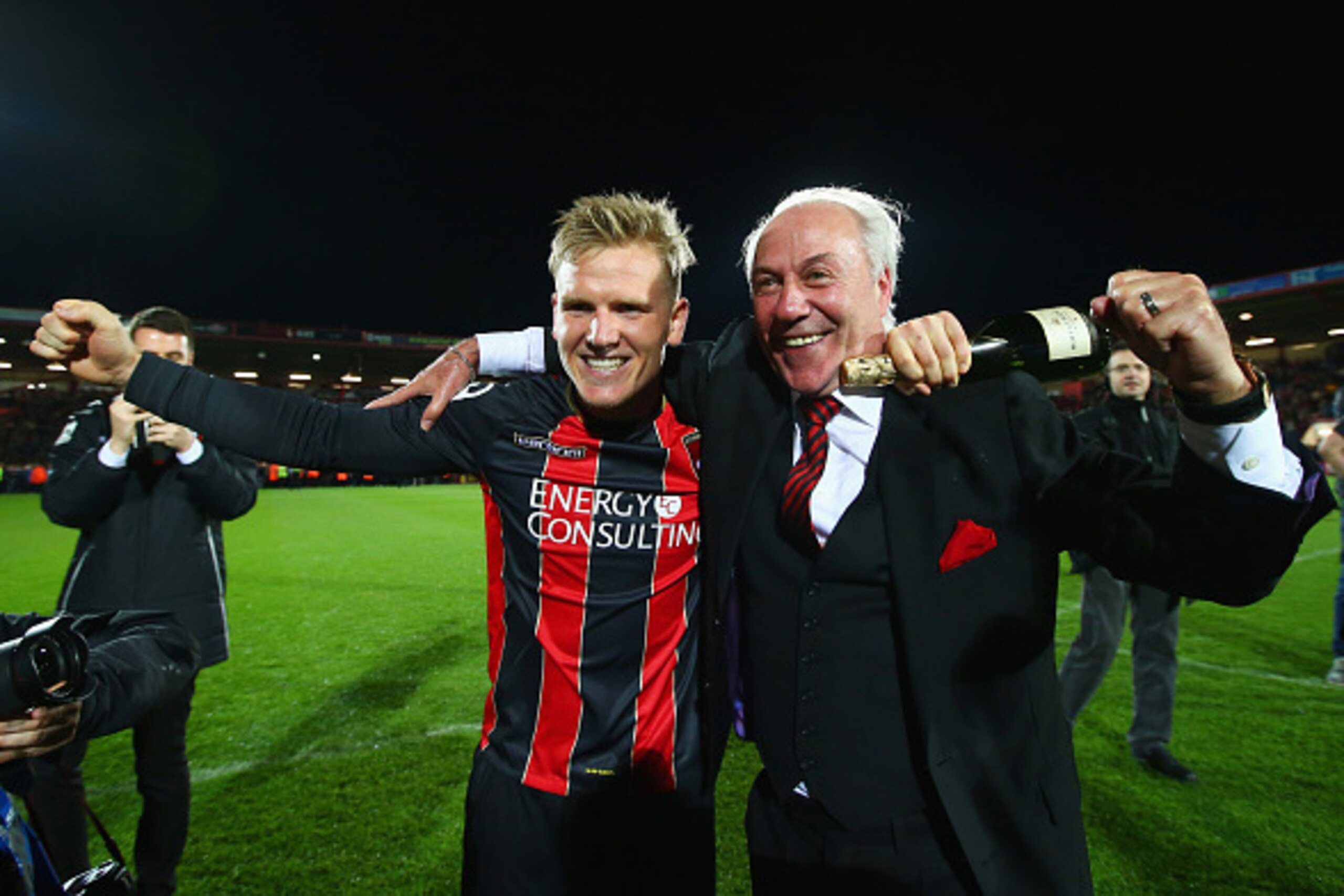 BOURNEMOUTH, ENGLAND - APRIL 27:  Matt Ritchie of Bournemouth and Bournemouth chairman Jeff Mostyn celebrate victory on the pitch after the Sky Bet Championship match between AFC Bournemouth and Bolton Wanderers at Goldsands Stadium on April 27, 2015 in B