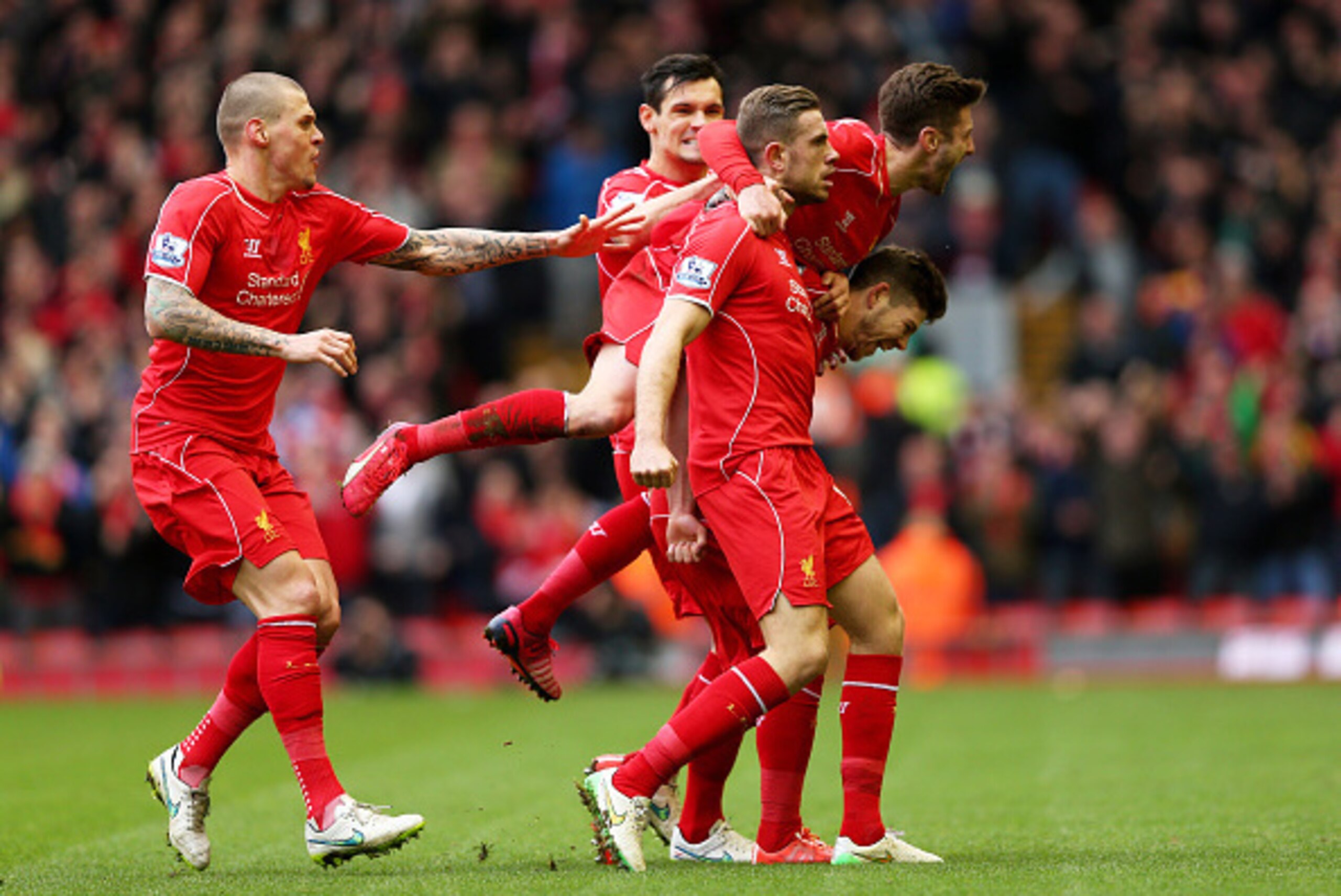 LIVERPOOL, ENGLAND - MARCH 01: Jordan Henderson (C) of Liverpool celebrates with teammates after scoring the opening goal during the Barclays Premier League match between Liverpool and Manchester City at Anfield on March 1, 2015 in Liverpool, England. ( LIVERPOOL, ENGLAND - MARCH 01: Jordan Henderson (C) of Liverpool celebrates with teammates after scoring the opening goal during the Barclays Premier League match between Liverpool and Manchester City at Anfield on March 1, 2015 in Liverpool, England. (