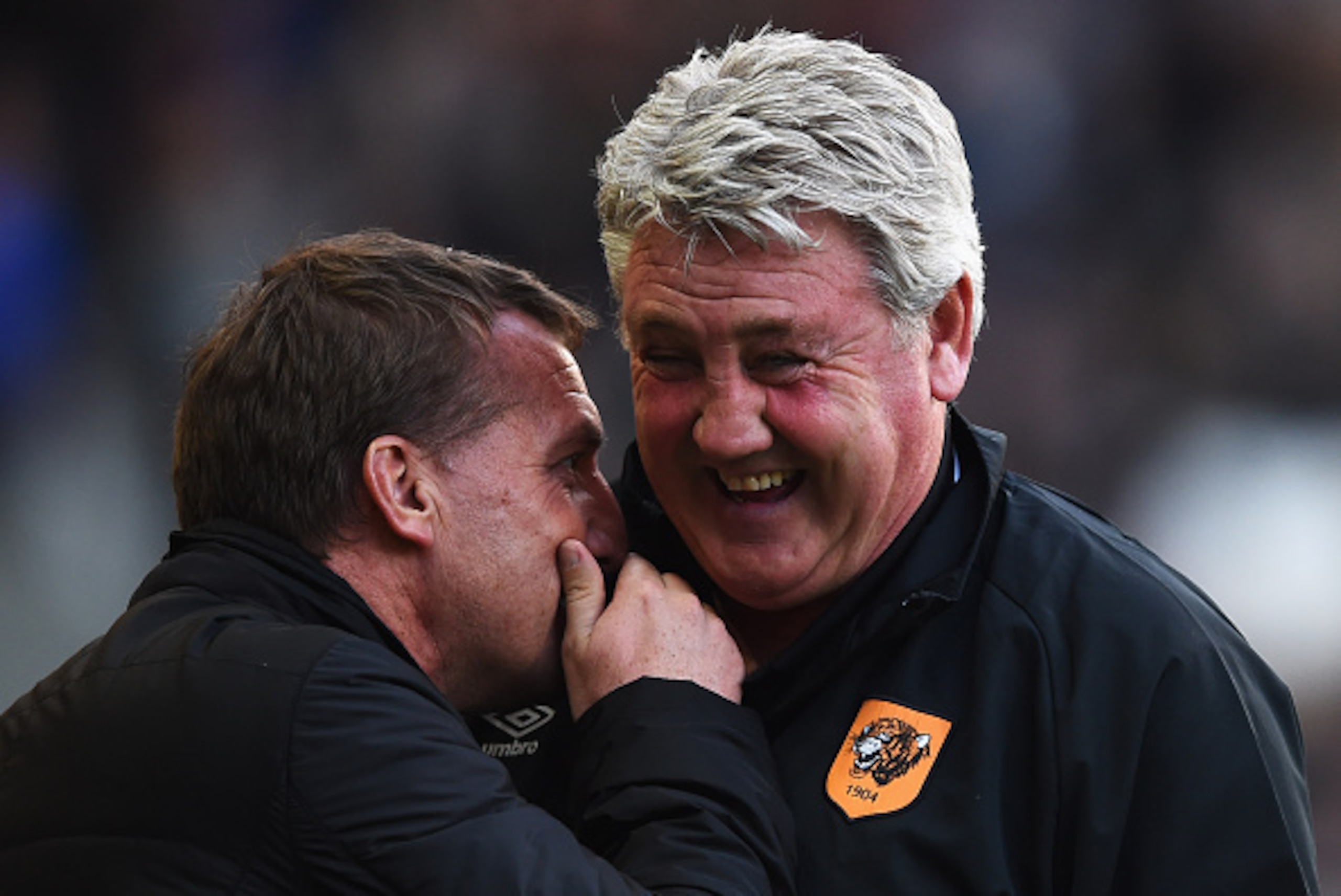 HULL, ENGLAND - APRIL 28: Brendan Rodgers manager of Liverpool and Steve Bruce manager of Hull City share a joke prior to the Barclays Premier League match between Hull City and Liverpool at KC Stadium on April 28, 2015 in Hull, England. (Photo by Laur HULL, ENGLAND - APRIL 28: Brendan Rodgers manager of Liverpool and Steve Bruce manager of Hull City share a joke prior to the Barclays Premier League match between Hull City and Liverpool at KC Stadium on April 28, 2015 in Hull, England. (Photo by Laur