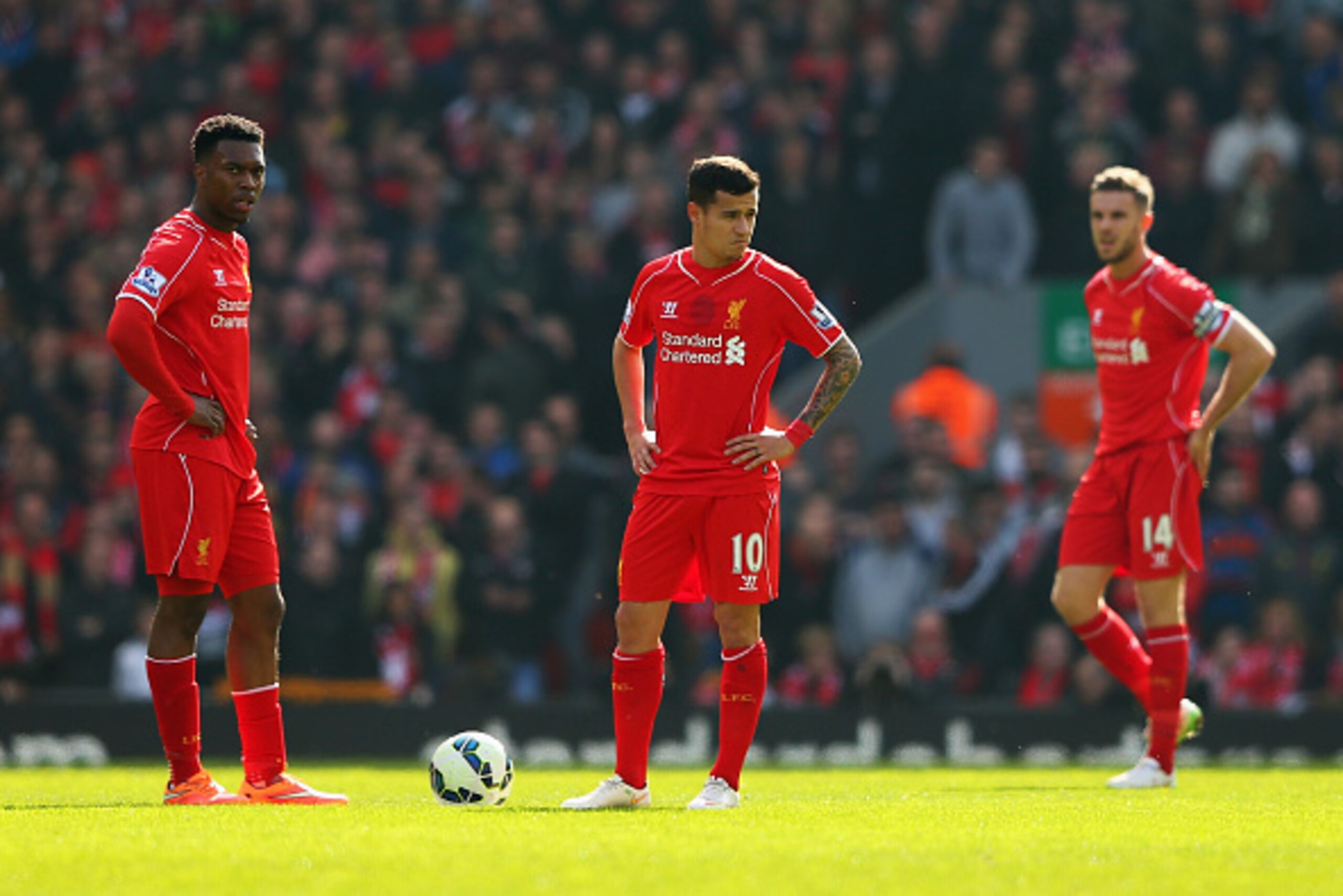 LIVERPOOL, ENGLAND - MARCH 22: Daniel Sturridge (L), Philippe Coutinho and Jordan Henderson of Liverpool look dejected after the opening goal by Juan Mata of Manchester United during the Barclays Premier League match between Liverpool and Manchester Unite LIVERPOOL, ENGLAND - MARCH 22: Daniel Sturridge (L), Philippe Coutinho and Jordan Henderson of Liverpool look dejected after the opening goal by Juan Mata of Manchester United during the Barclays Premier League match between Liverpool and Manchester Unite