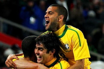 JOHANNESBURG, SOUTH AFRICA - JUNE 28:  Luis Fabiano of Brazil (L) celebrates scoring his team's second goal with team mates Kaka and Dani Alves  during the 2010 FIFA World Cup South Africa Round of Sixteen match between Brazil and Chile at Ellis Park Stad