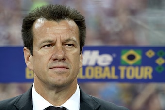 SINGAPORE - OCTOBER 14:  Brazil coach, Dunga is seen on the team bench during the international friendly match between Japan and Brazil at the National Stadium on October 14, 2014 in Singapore.  (Photo by Suhaimi Abdullah/Getty Images)