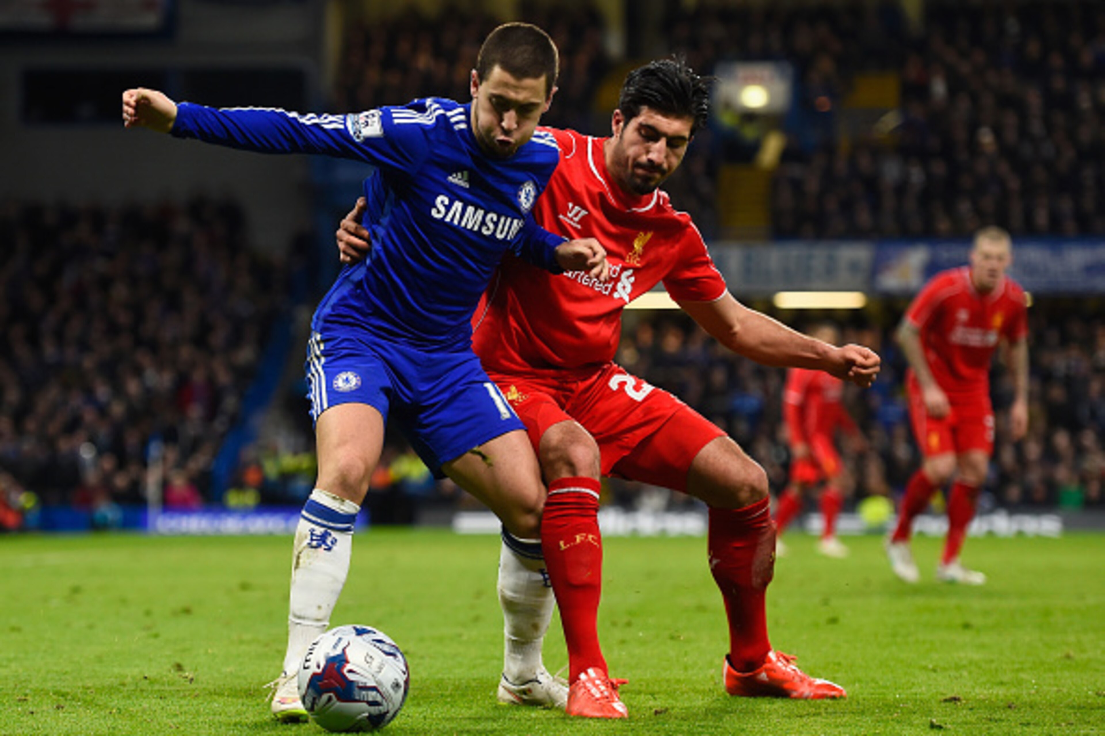 LONDON, ENGLAND - JANUARY 27:  Eden Hazard of Chelsea is challenged by Emre Can of Liverpool during the Capital One Cup Semi-Final second leg between Chelsea and Liverpool at Stamford Bridge on January 27, 2015 in London, England.  (Photo by Mike Hewitt/G