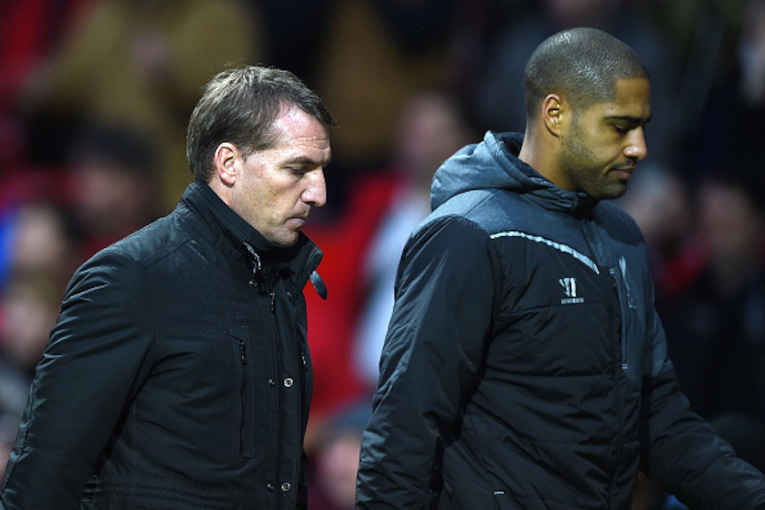 MANCHESTER, ENGLAND - DECEMBER 14:  Liverpool Manager Brendan Rodgers walks off with Glen Johnson at the end of the Barclays Premier League match between Manchester United and Liverpool at Old Trafford on December 14, 2014 in Manchester, England.  (Photo 