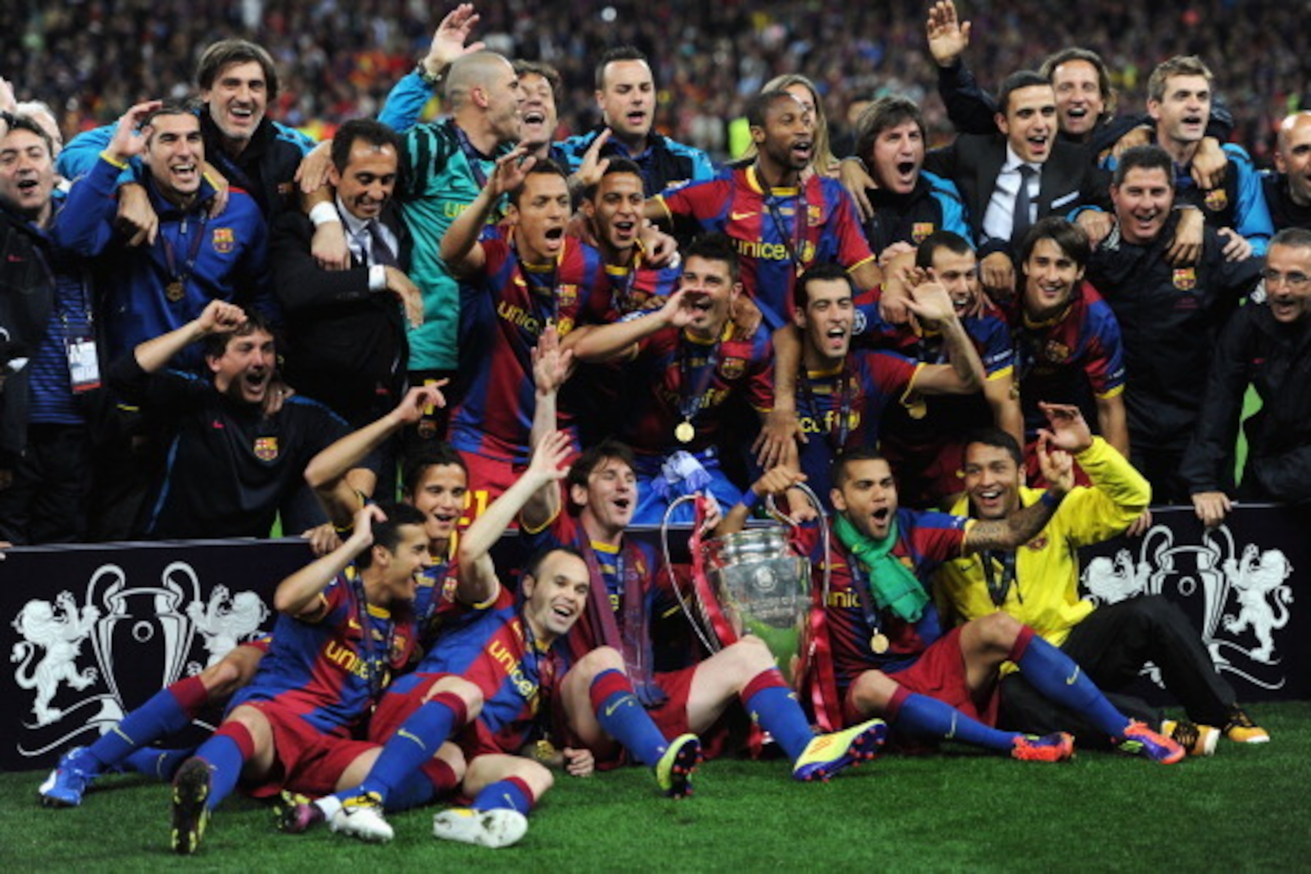 LONDON, ENGLAND - MAY 28: Lionel Messi (C,L) and Daniel Alves (C,R) of Barcelona hold the trophy as the team pose for photographs after victory in the UEFA Champions League final between FC Barcelona and Manchester United FC at Wembley Stadium on May 28, LONDON, ENGLAND - MAY 28: Lionel Messi (C,L) and Daniel Alves (C,R) of Barcelona hold the trophy as the team pose for photographs after victory in the UEFA Champions League final between FC Barcelona and Manchester United FC at Wembley Stadium on May 28,