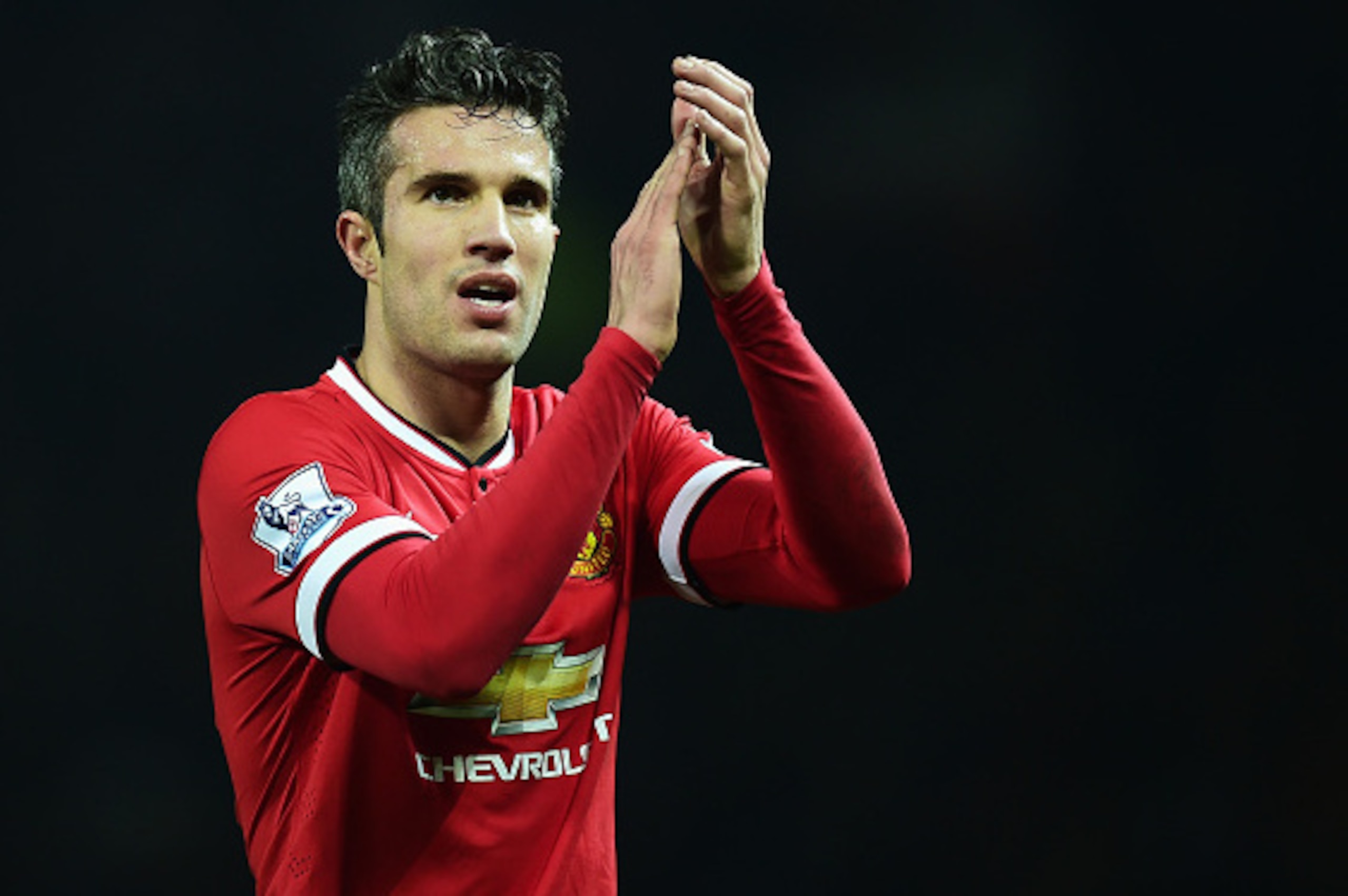MANCHESTER, ENGLAND - FEBRUARY 11: Robin van Persie of Manchester United celebrates victory after the Barclays Premier League match between Manchester United and Burnley at Old Trafford on February 11, 2015 in Manchester, England.  (Photo by Jamie McDonal