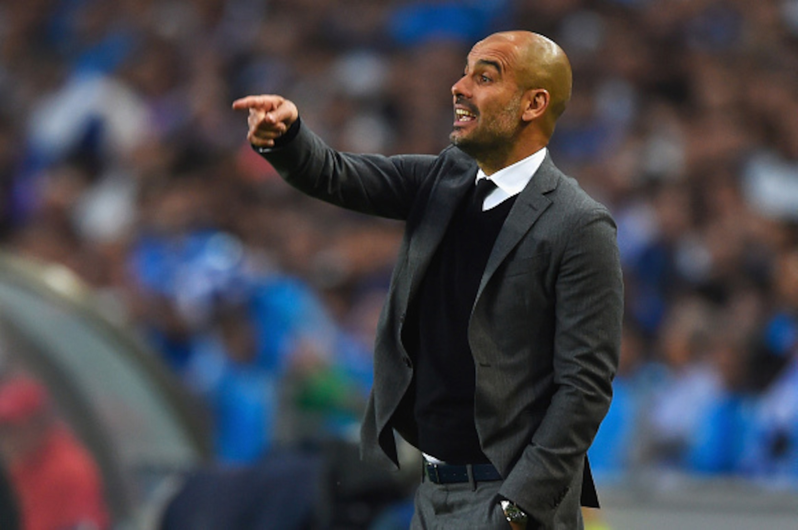 PORTO, PORTUGAL - APRIL 15:  Josep Guardiola head coach of Bayern Muenchen signals during the UEFA Champions League Quarter Final first leg match between FC Porto and FC Bayern Muenchen at Estadio do Dragao on April 15, 2015 in Porto, Portugal.  (Photo by