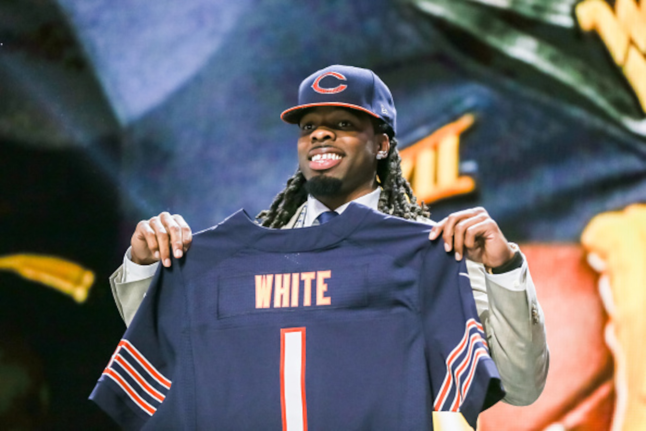 CHICAGO, IL - APRIL 30:  Kevin White of the West Virginia Mountaineers holds up a jersey after being chosen #7 overall by the Chicago Bears during the first round of the 2015 NFL Draft at the Auditorium Theatre of Roosevelt University on April 30, 2015 in