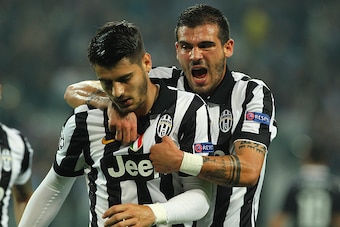 TURIN, ITALY - MAY 05:  Alvaro Morata of Juventus FC celebrates with his team-mate Stefano Sturaro after scoring the opening goal during the UEFA Champions League semi final match between Juventus and Real Madrid CF at Juventus Arena on May 5, 2015 in Tur