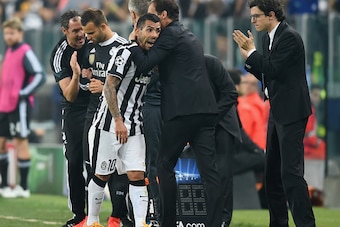 TURIN, ENGLAND - MAY 05:  Carlos Tevez of Juventus is embraced by Massimiliano Allegri manager of Juventus as he is substituted during the UEFA Champions League semi final first leg match between Juventus and Real Madrid CF at Juventus Arena on May 5, 201