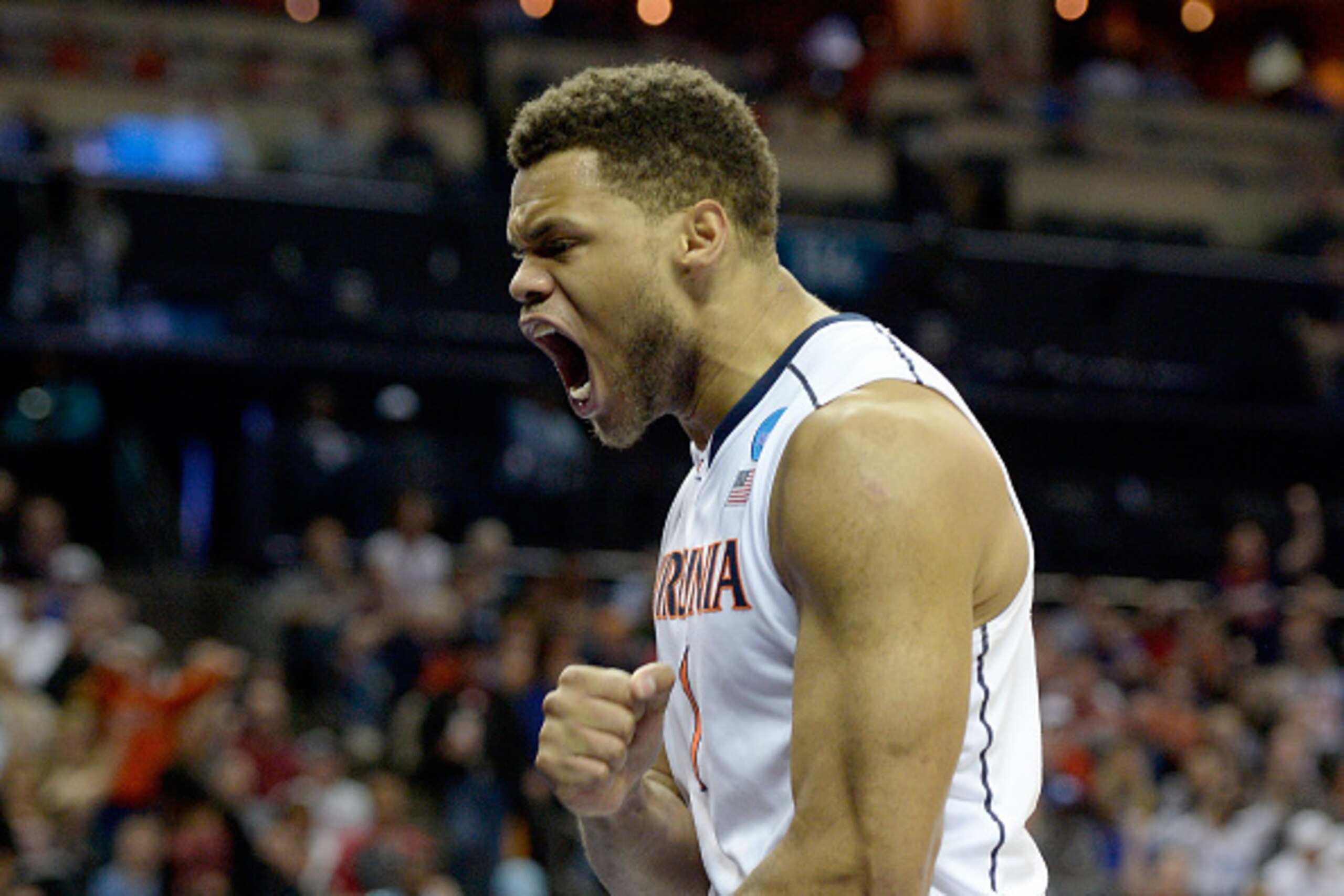 CHARLOTTE, NC - MARCH 22:  Justin Anderson #1 of the Virginia Cavaliers reacts against the Michigan State Spartans during the third round of the 2015 NCAA Men's Basketball Tournament at Time Warner Cable Arena on March 22, 2015 in Charlotte, North Carolin