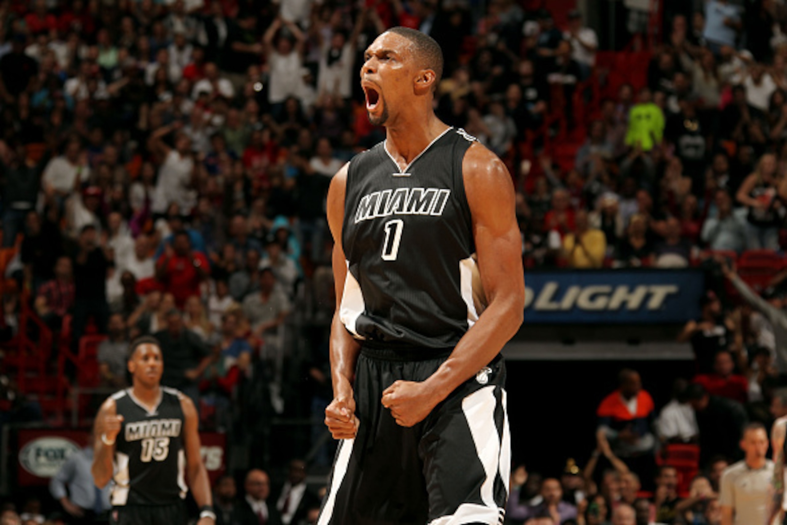MIAMI, FL - FEBRUARY 9: Chris Bosh #1 of the Miami Heat celebrates during a game against the New York Knicks on February 9, 2015 at American Airlines Arena in Miami, Florida. NOTE TO USER: User expressly acknowledges and agrees that, by downloading and or MIAMI, FL - FEBRUARY 9: Chris Bosh #1 of the Miami Heat celebrates during a game against the New York Knicks on February 9, 2015 at American Airlines Arena in Miami, Florida. NOTE TO USER: User expressly acknowledges and agrees that, by downloading and or