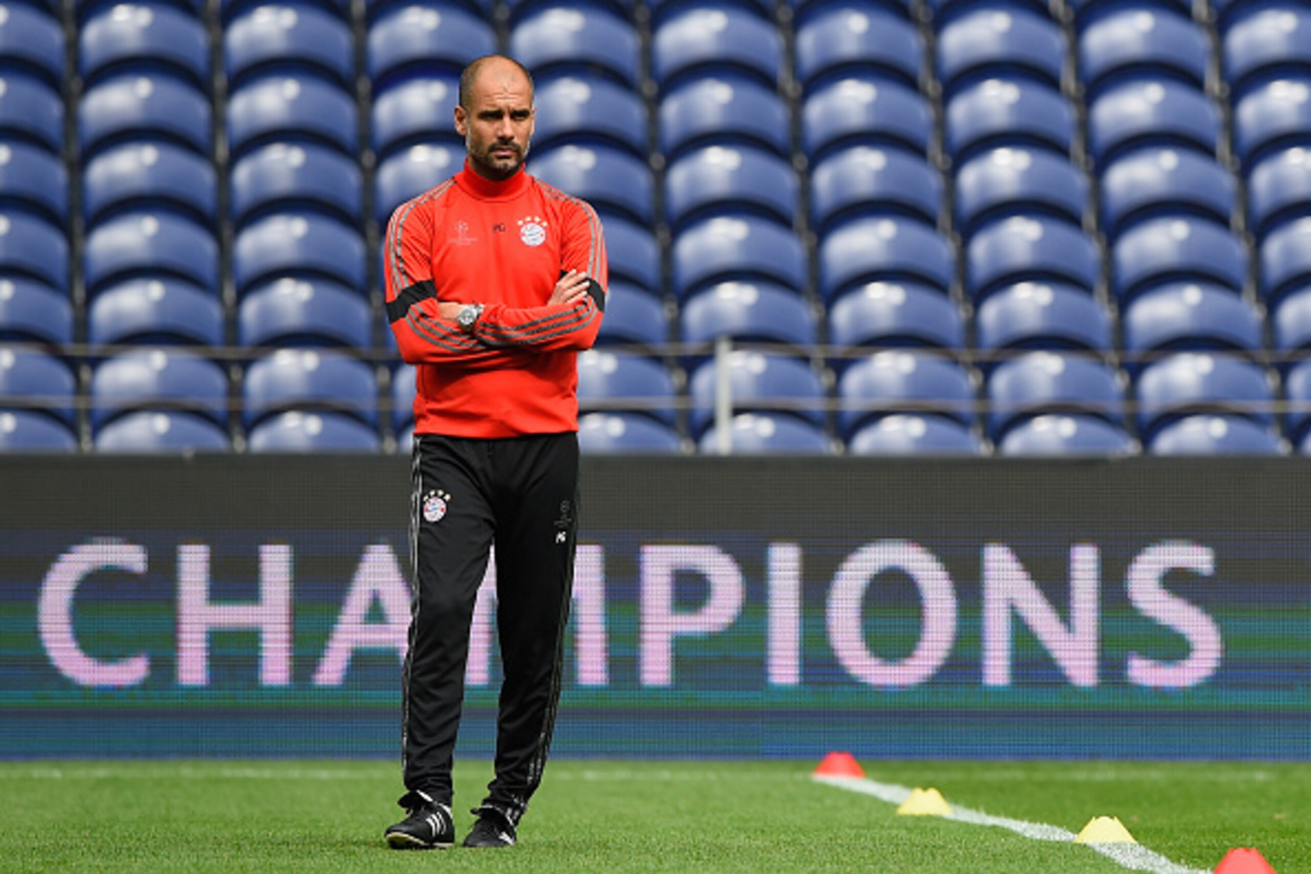 PORTO, PORTUGAL - APRIL 14:  Head coach Pep Guardiola looks on during a FC Bayern Muenchen Training Session ahead of the UEFA Champions League Quarter-Final First Leg match between Porto and FC Bayern Muenchen at Estadio do Dragao on April 14, 2015 in Por