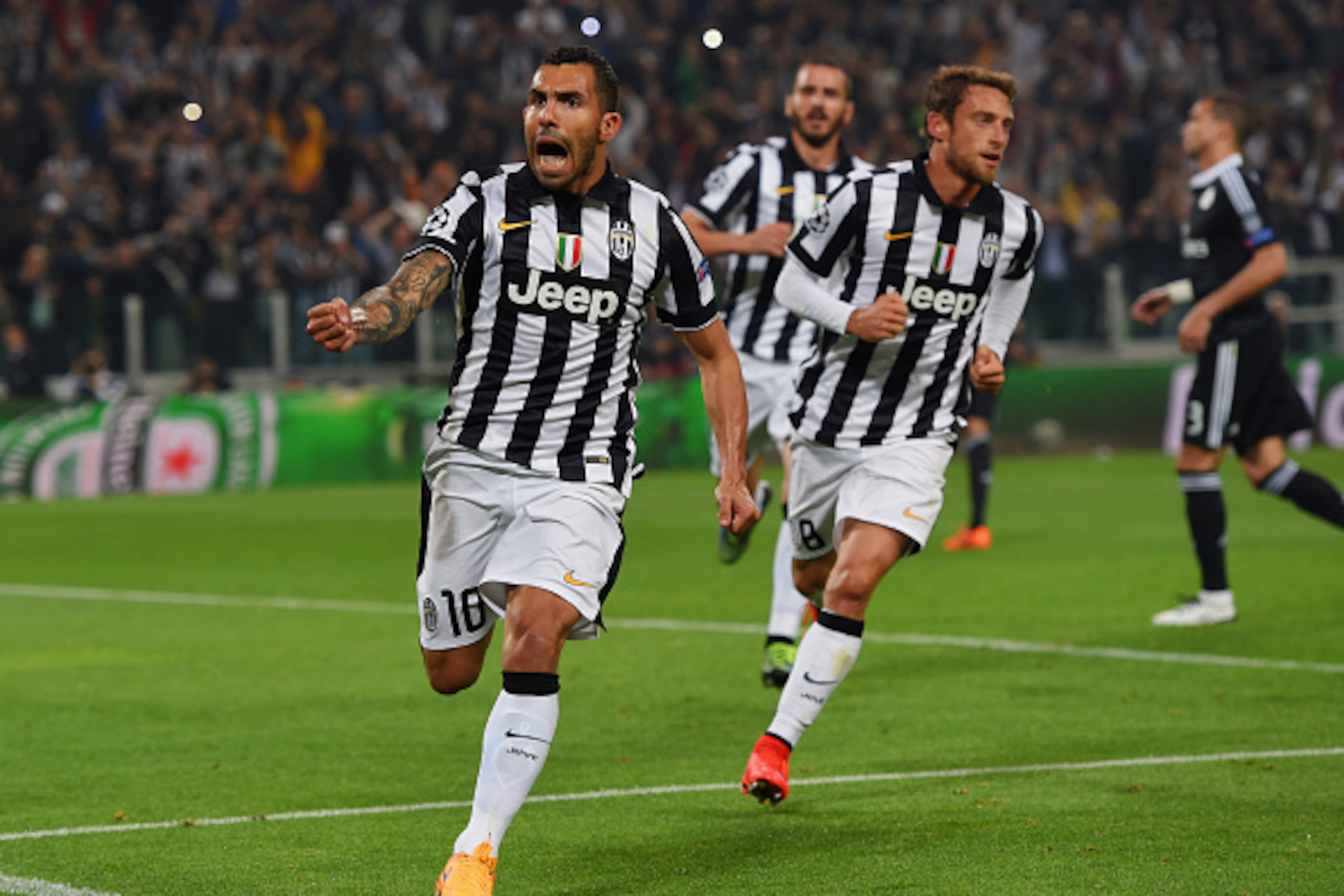 TURIN, ENGLAND - MAY 05:  Carlos Tevez of Juventus (10) celebrates with Claudio Marchisio (8) as he scores their second goal from a penalty during the UEFA Champions League semi final first leg match between Juventus and Real Madrid CF at Juventus Arena o