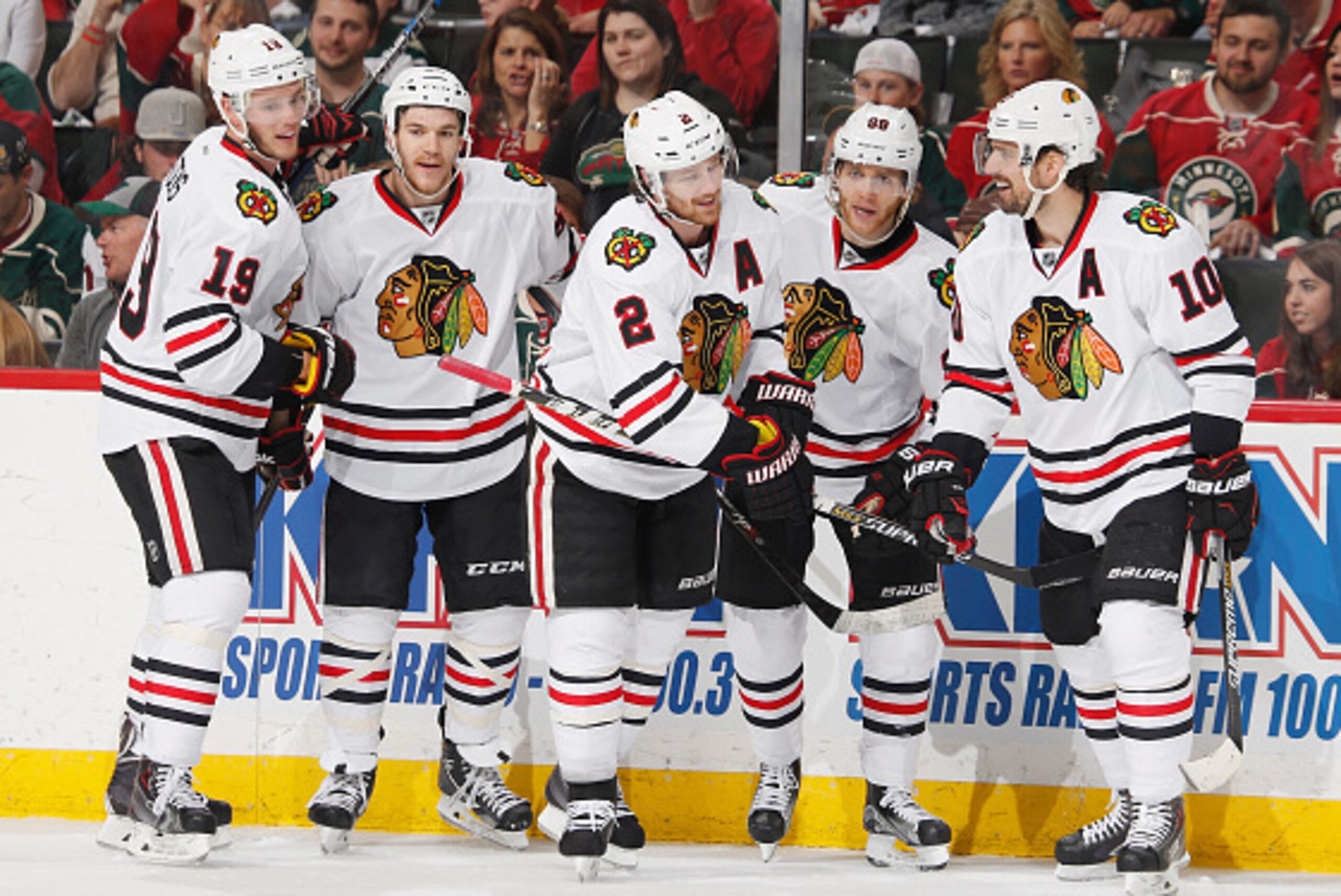 ST. PAUL, MN - MAY 5: (L-R) Jonathan Toews #19, Andrew Shaw #65, Duncan Keith #2, Patrick Kane #88, and Patrick Sharp #10 of the Chicago Blackhawks celebrate after scoring a goal against the Minnesota Wild in Game Three of the Western Conference Semifinal