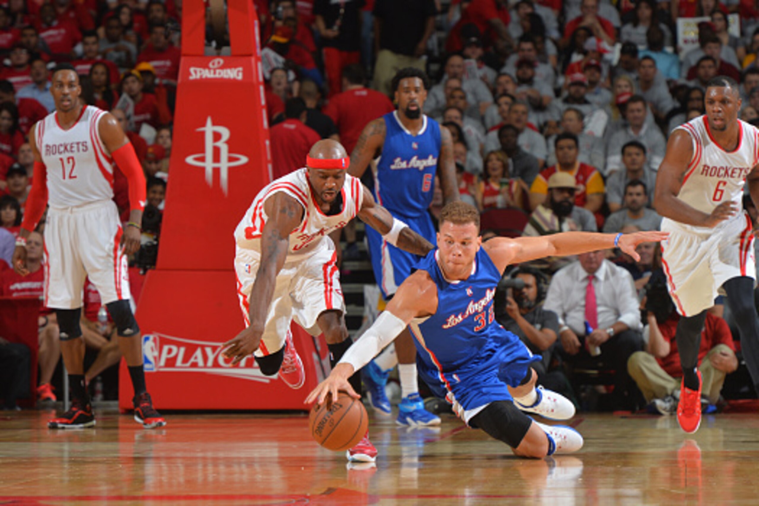 HOUSTON,TEXAS : Blake Griffin #32 of the Los Angeles Clippers goes after the loose ball against the Houston Rockets at the Toyota Center During Game One of the Western Conference Semifinals during the 2015 NBA Playoffs on May 4, 2015 in Houston,Texas NOTE
