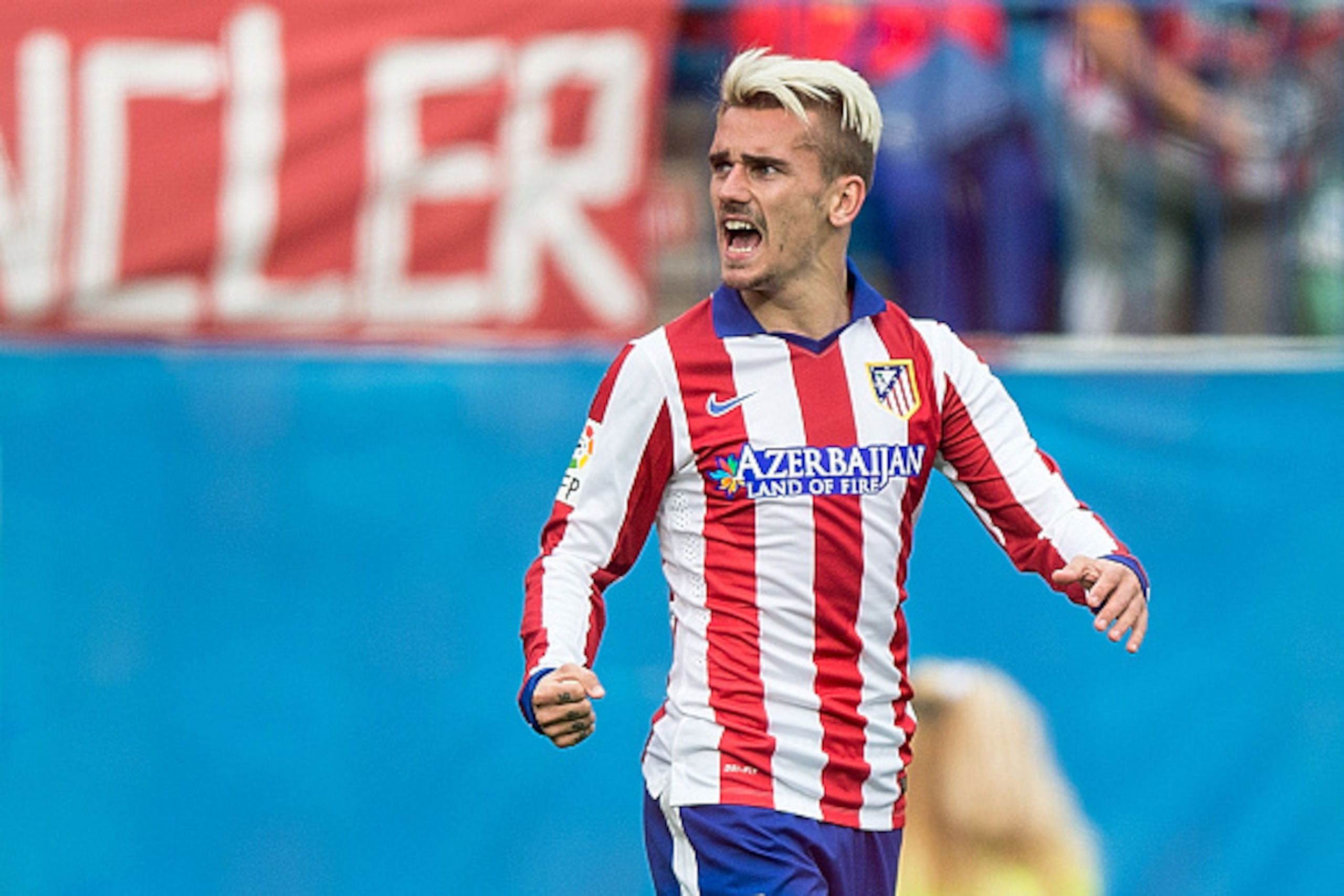 MADRID, SPAIN - APRIL 25: Antoine Griezmann of Atletico de Madrid celebrates scoring their opening goal during the La Liga match between Club Atletico de Madrid and Elche FC at Vicente Calderon Stadium on April 25, 2015 in Madrid, Spain.  (Photo by Gonzal