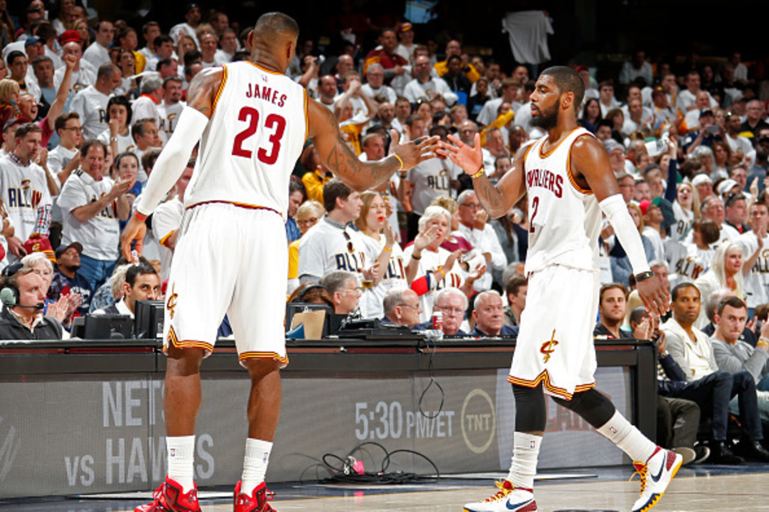 CLEVELAND, OH - APRIL 19:  LeBron James #23 and Kyrie Irving #2 of the Cleveland Cavaliers during the game against the Boston Celtics during Game One of the Eastern Conference Quarterfinals of the NBA Playoffs at The Quicken Loans Arena on April 19, 2015 