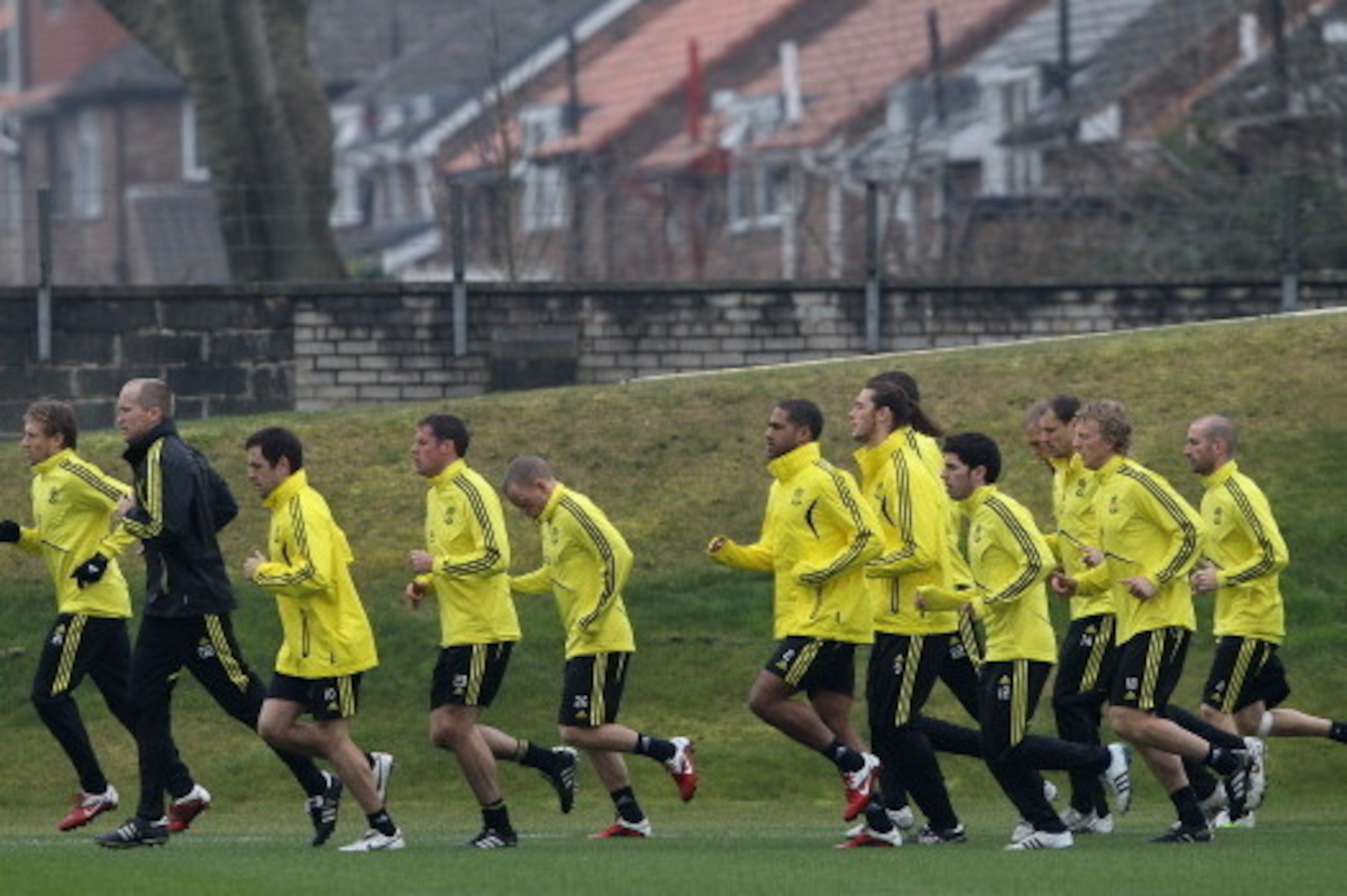 LIVERPOOL, ENGLAND - MARCH 16: Liverpool players jog at the start of training led by Lucas and Joe Cole during a training session ahead of their UEFA Europa League Round of 16 second leg match against Braga at Melwood Training Ground on March 16, 2010 in 