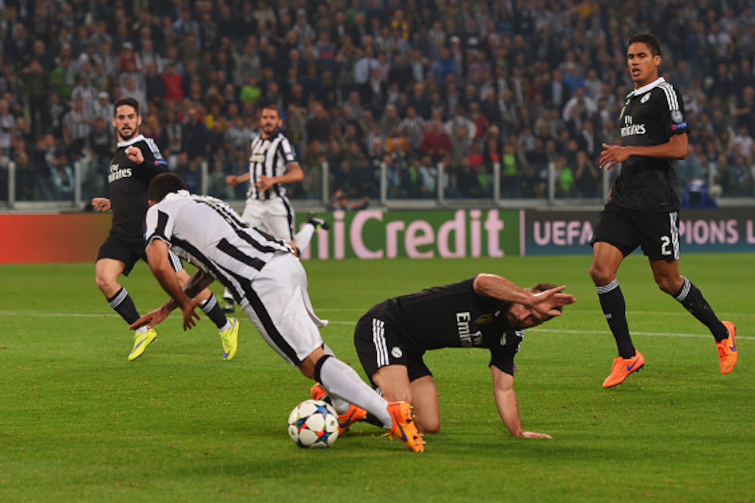 TURIN, ENGLAND - MAY 05:  Carlos Tevez of Juventus is fouled by Daniel Carvajal of Real Madrid CF for a penalty during the UEFA Champions League semi final first leg match between Juventus and Real Madrid CF at Juventus Arena on May 5, 2015 in Turin, Ital