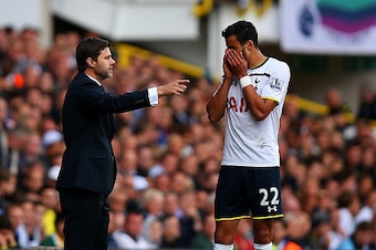 LONDON, ENGLAND - OCTOBER 05:  Manager Mauricio Pochettino of Spurs speaks with Nacer Chadli of Spurs during the Barclays Premier League match between Tottenham Hotspur and Southampton at White Hart Lane on October 5, 2014 in London, England.  (Photo by B