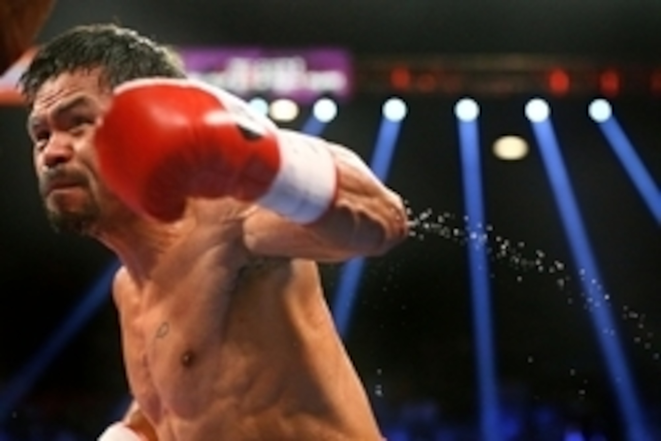 May 2, 2015; Las Vegas, NV, USA; Sweat flies off the arm of Manny Pacquiao as he swings at Floyd Mayweather (not pictured) during their boxing bout at the MGM Grand Garden Arena. Mandatory Credit: Mark J. Rebilas-USA TODAY Sports May 2, 2015; Las Vegas, NV, USA; Sweat flies off the arm of Manny Pacquiao as he swings at Floyd Mayweather (not pictured) during their boxing bout at the MGM Grand Garden Arena. Mandatory Credit: Mark J. Rebilas-USA TODAY Sports
