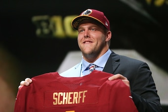 CHICAGO, IL - APRIL 30:  Brandon Scherff of the Iowa Hawkeyes holds up a jersey after being chosen #5 overall by the Washington Redskins during the first round of the 2015 NFL Draft at the Auditorium Theatre of Roosevelt University on April 30, 2015 in Ch