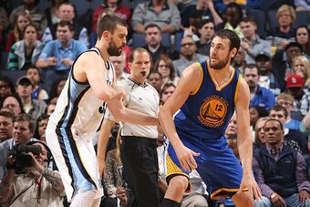 MEMPHIS, TN - MARCH 27:  Andrew Bogut #12 of the Golden State Warriors handles the ball against Marc Gasol #33 of the Memphis Grizzlies on March 27, 2015 at FedExForum in Memphis, Tennessee. NOTE TO USER: User expressly acknowledges and agrees that, by do
