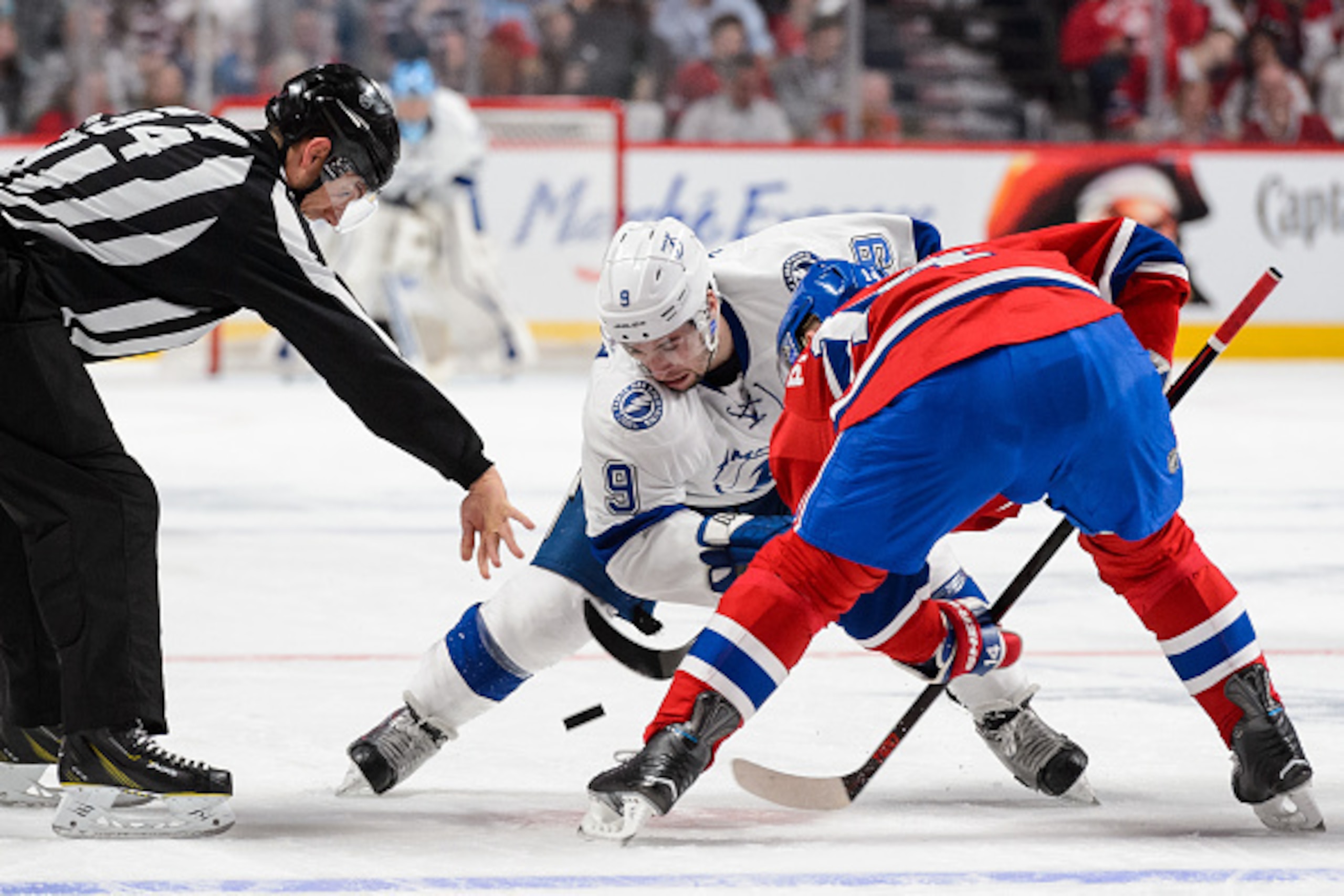 MONTREAL, QC - MAY 03:  Tyler Johnson #9 of the Tampa Bay Lightning and Tomas Plekanec #14 of the Montreal Canadiens take a face-off in Game Two of the Eastern Conference Semifinals during the 2015 NHL Stanley Cup Playoffs at the Bell Centre on May 3, 201