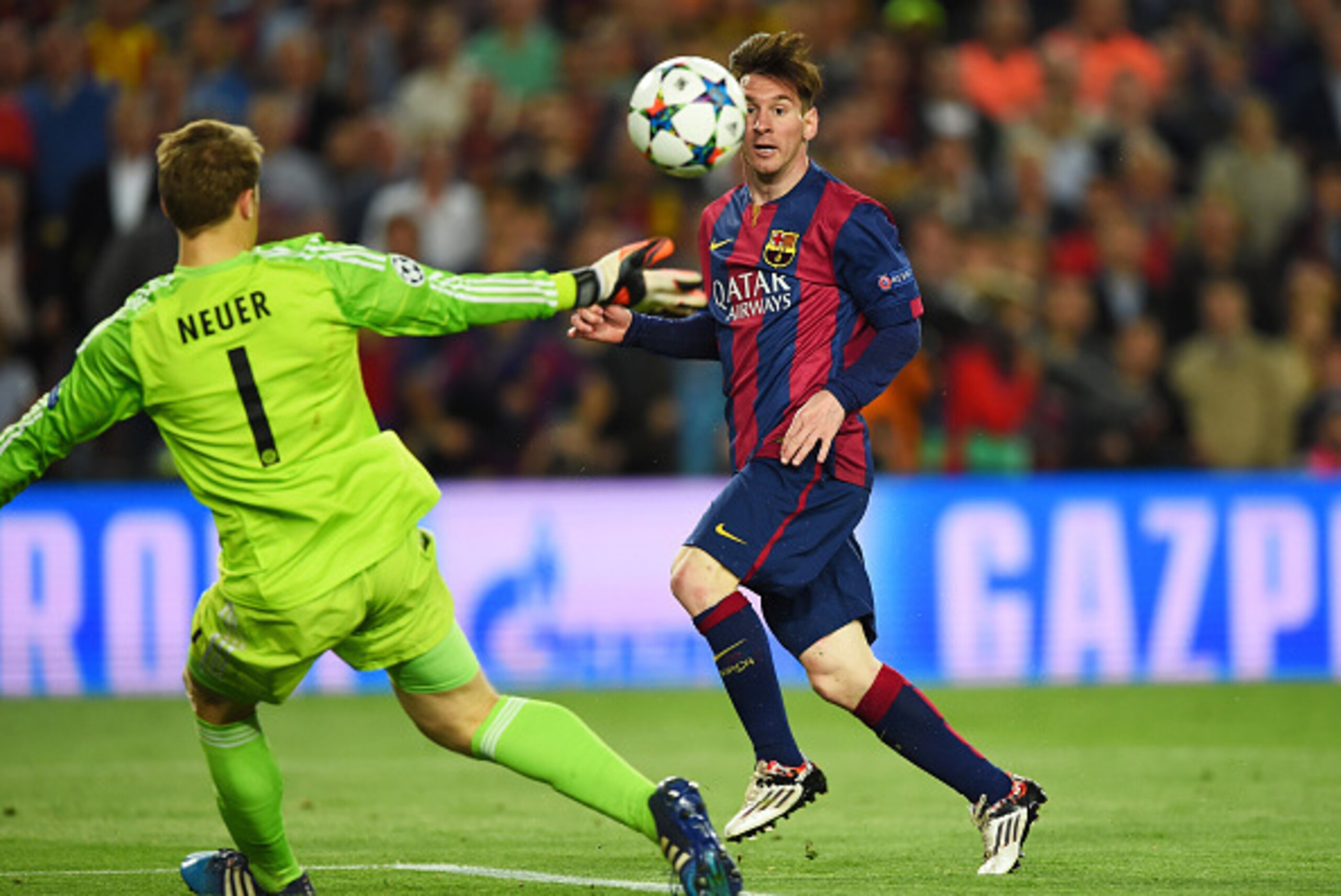 BARCELONA, SPAIN - MAY 06:  Lionel Messi of Barcelona chips the ball over goalkeeper Manuel Neuer of Bayern Muenchen to score his team's second goal during the UEFA Champions League Semi Final, first leg match between FC Barcelona and FC Bayern Muenchen a
