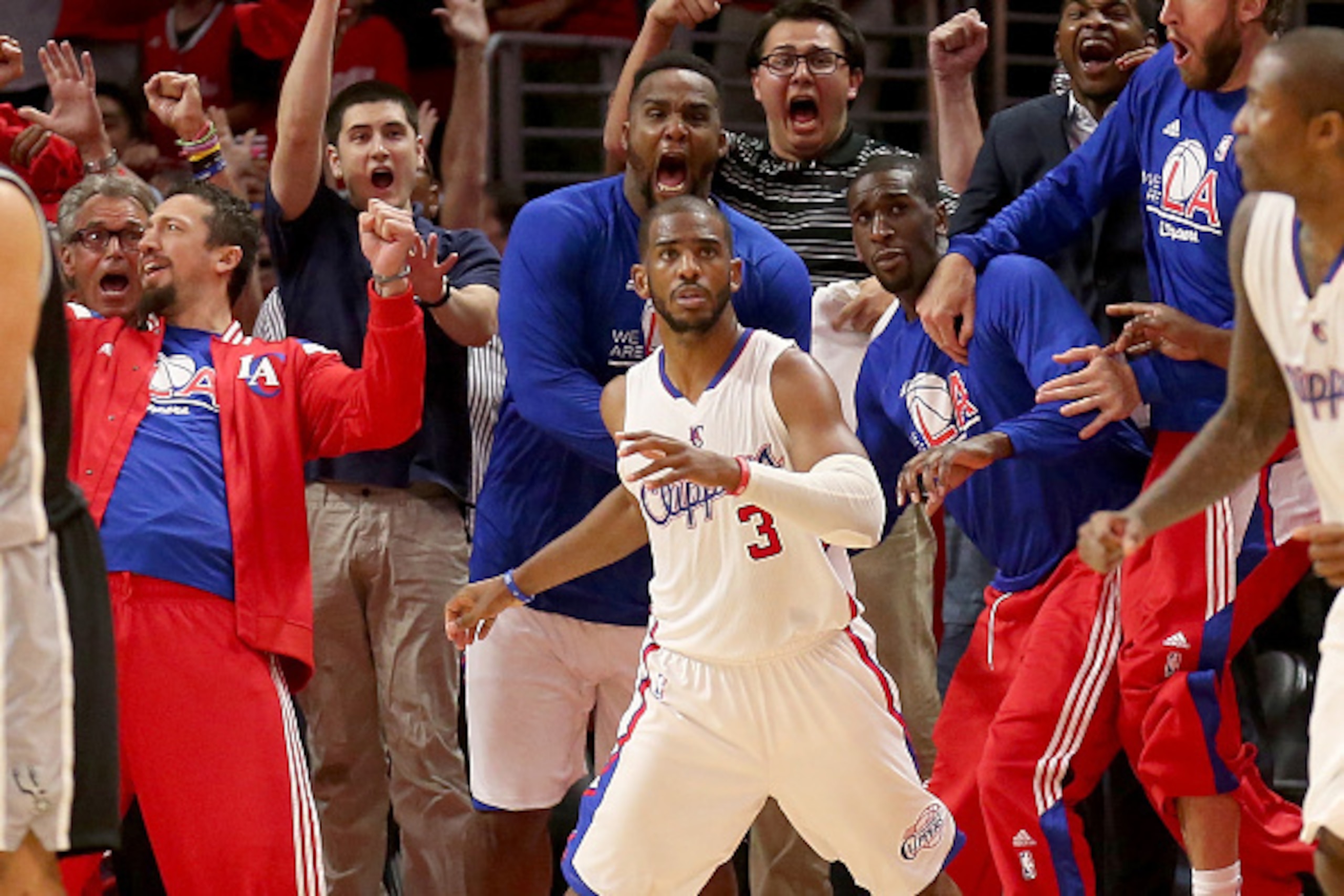 LOS ANGELES, CA - MAY 02:  Chris Paul #3 the Los Angeles Clippers and the Clippers bench react after Paul made a basket with one second remaining to give the Clippers the win against the San Antonio Spurs during Game Seven of the Western Conference quarte