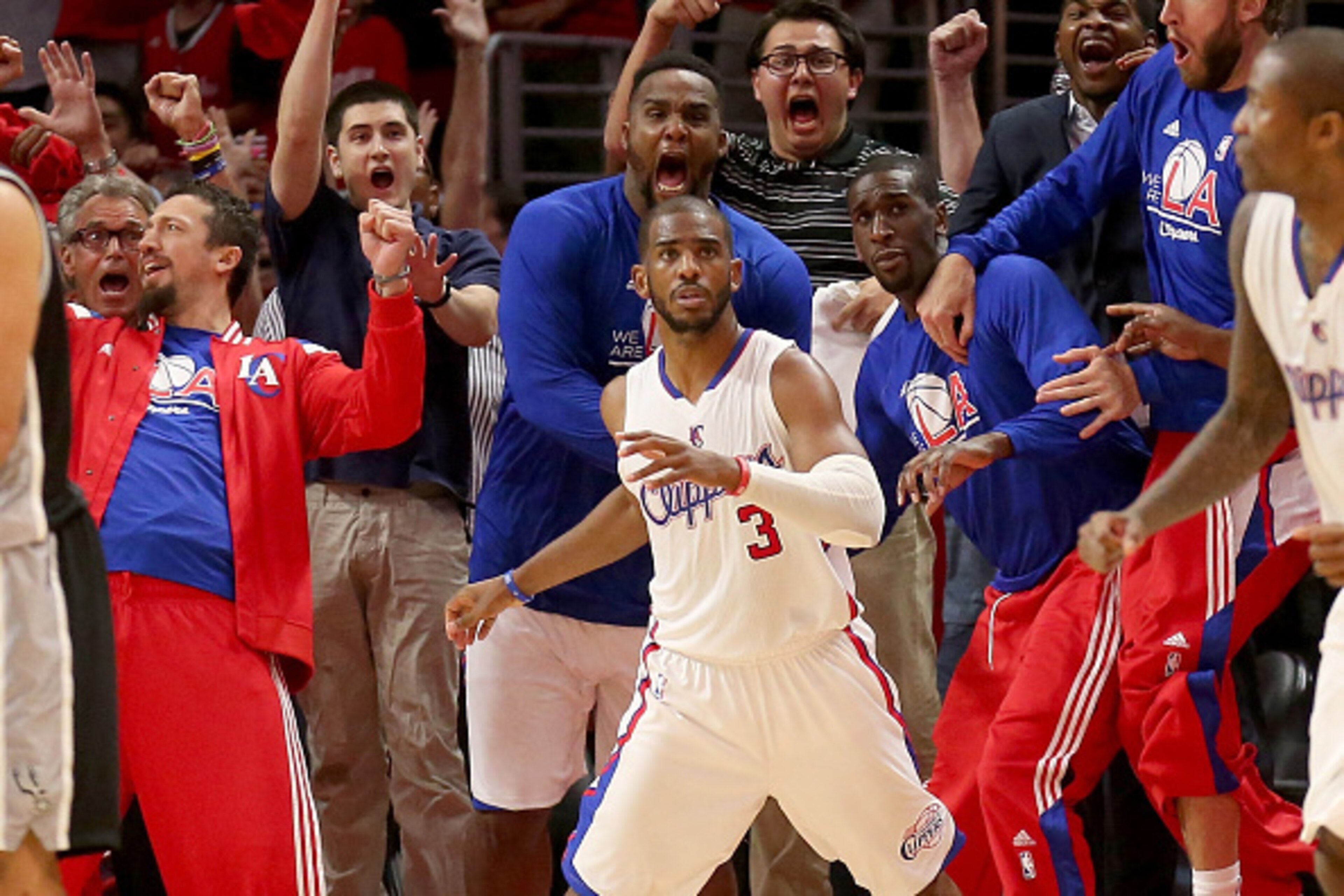 LOS ANGELES, CA - MAY 02:  Chris Paul #3 the Los Angeles Clippers and the Clippers bench react after Paul made a basket with one second remaining to give the Clippers the win against the San Antonio Spurs during Game Seven of the Western Conference quarte