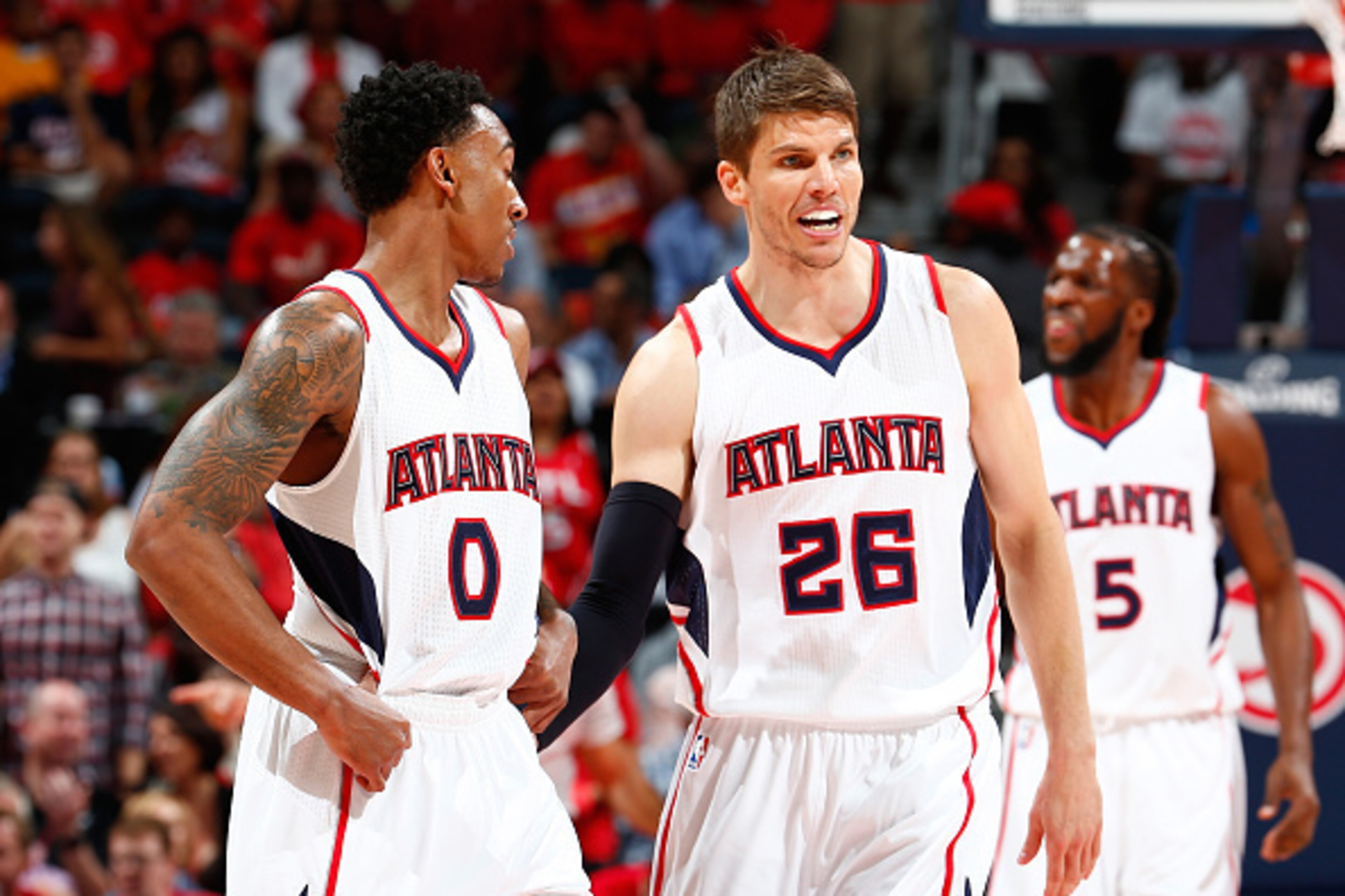 ATLANTA, GA - MAY 05:  Kyle Korver #26 of the Atlanta Hawks converses with Jeff Teague #0 during Game Two of the Eastern Conference Semifinals of the 2015 NBA Playoffs against the Washington Wizards at Philips Arena on May 5, 2015 in Atlanta, Georgia.  NO