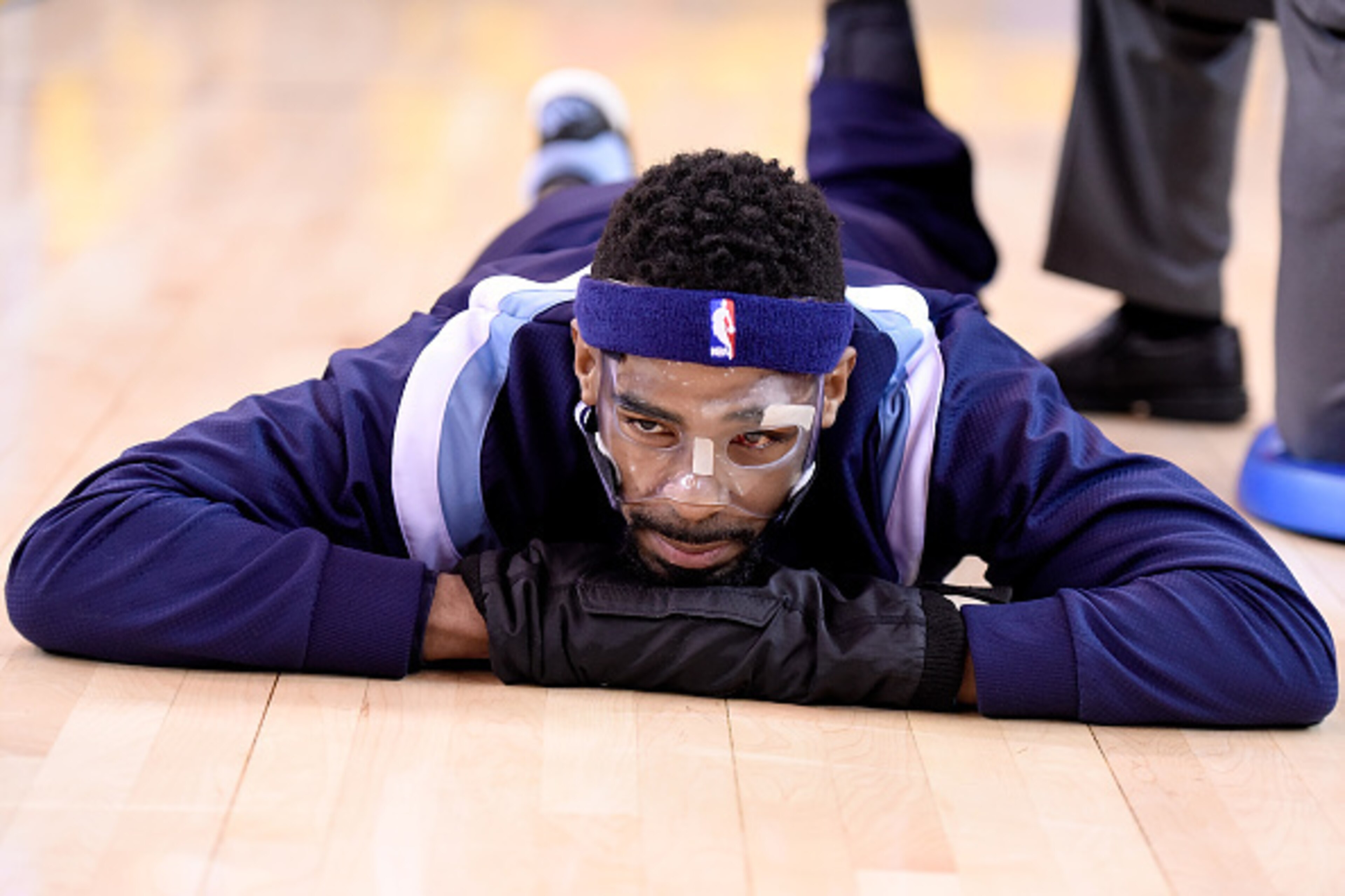 OAKLAND, CA - MAY 05:  Mike Conley #11 of the Memphis Grizzlies warms up stretching prior to the start of Game Two of the Western Conference Semifinals of the NBA Playoffs against the Golden State Warriors at ORACLE Arena on May 5, 2015 in Oakland, Califo
