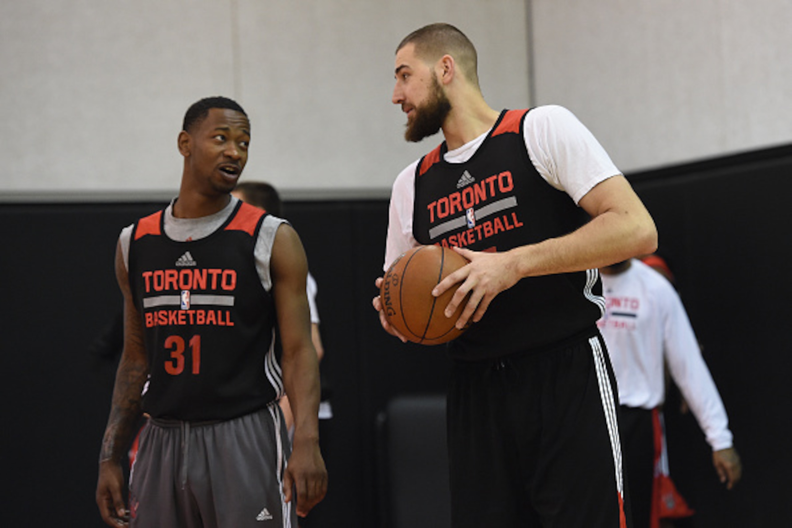 TORONTO, CANADA - April 17:  Terrence Ross #31 and Jonas Valanciunas #17 of the Toronto Raptors talk during an all access practice event on April 17, 2015 at the Air Canada Centre in Toronto, Ontario, Canada.  NOTE TO USER: User expressly acknowledges and