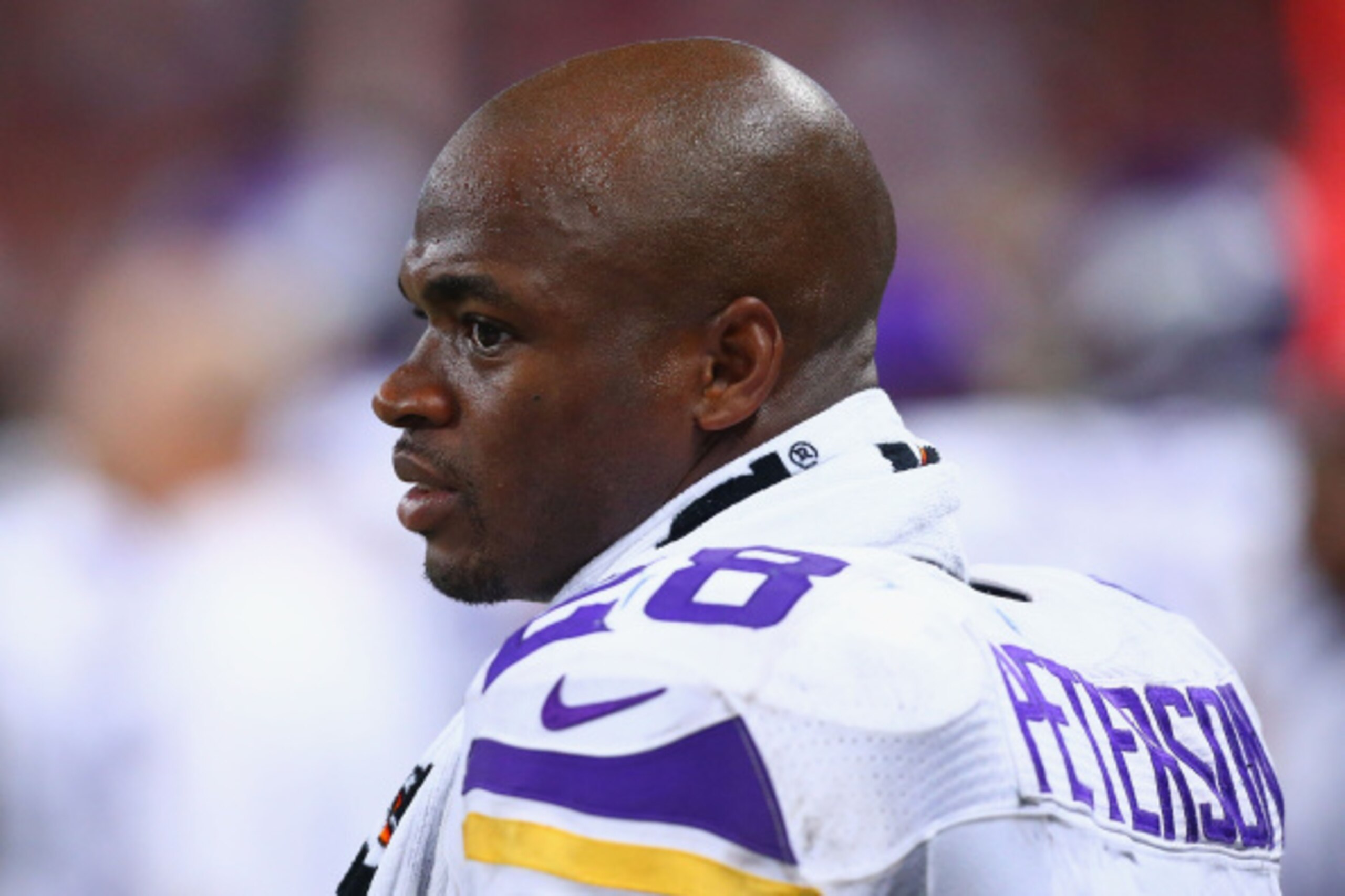 ST. LOUIS, MO - SEPTEMBER 7: Adrian Peterson #28 of the Minnesota Vikings looks on from the sideline during a game against the St. Louis Rams at the Edward Jones Dome on September 7, 2014 in St. Louis, Missouri.  The Vikings beat the Rams 34-6.  (Photo by
