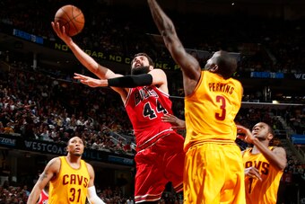 CLEVELAND, OHIO - MAY 6: Nikola Mirotic #44 of the Chicago Bulls goes for the lay up against the Cleveland Cavaliers during Game Two of the Eastern Conference Semifinals during the NBA Playoffs on May 6, 2015 at Quicken Loans Arena in Cleveland, Ohio.  NO